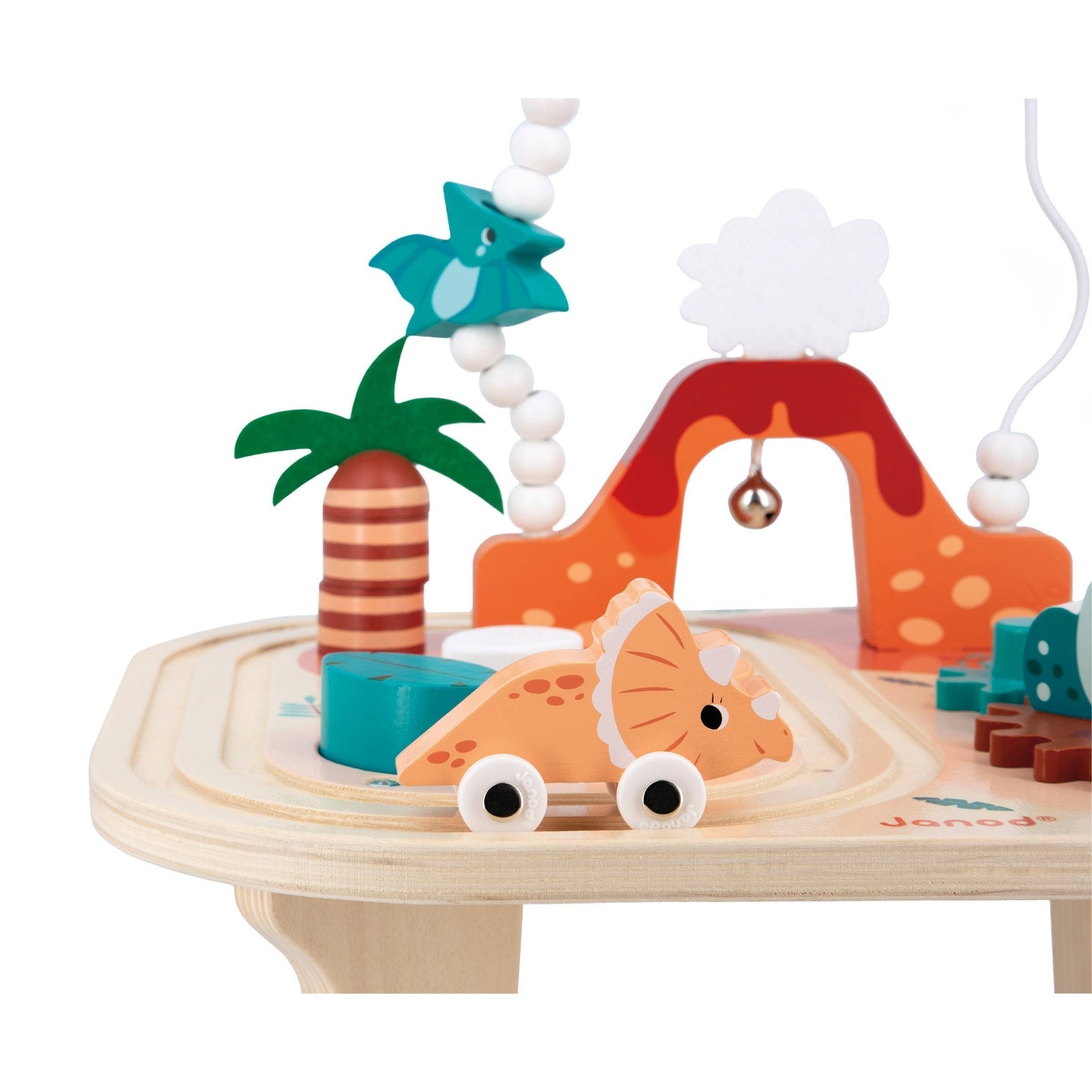 Wooden toy set with a dinosaur, palm tree, and coral on a white background