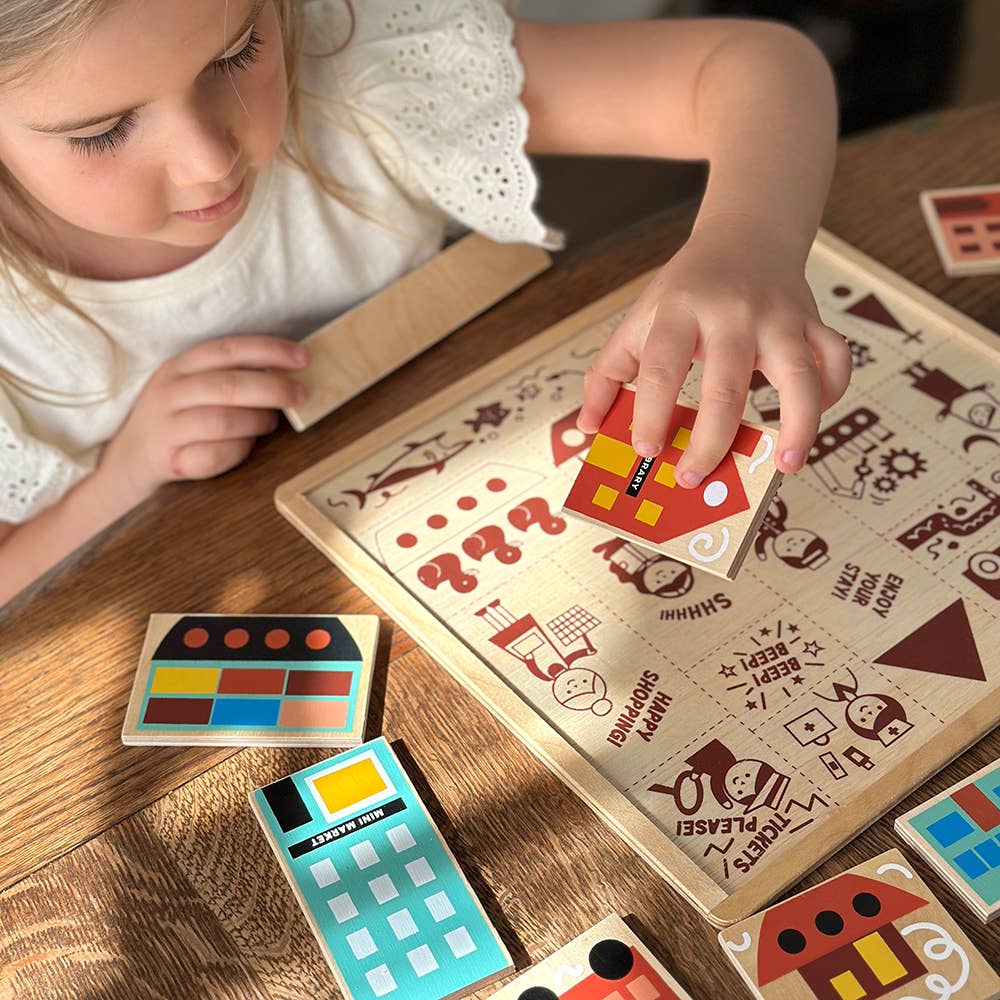 Child playing with a wooden puzzle on a wooden table