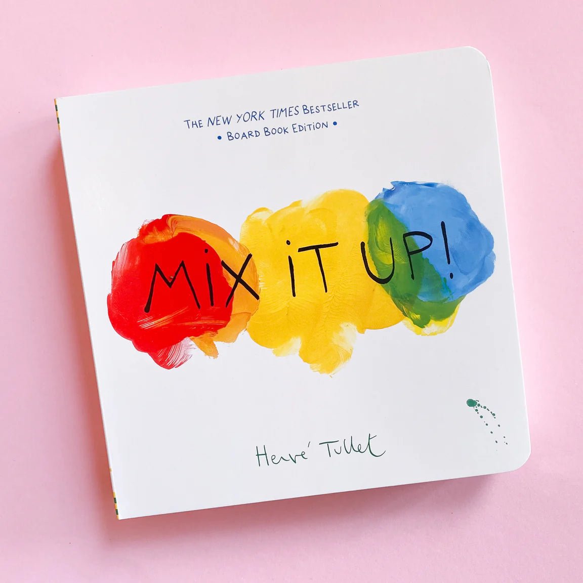 Children's book titled 'Mix It Up!' with colorful paint splashes on a pink background