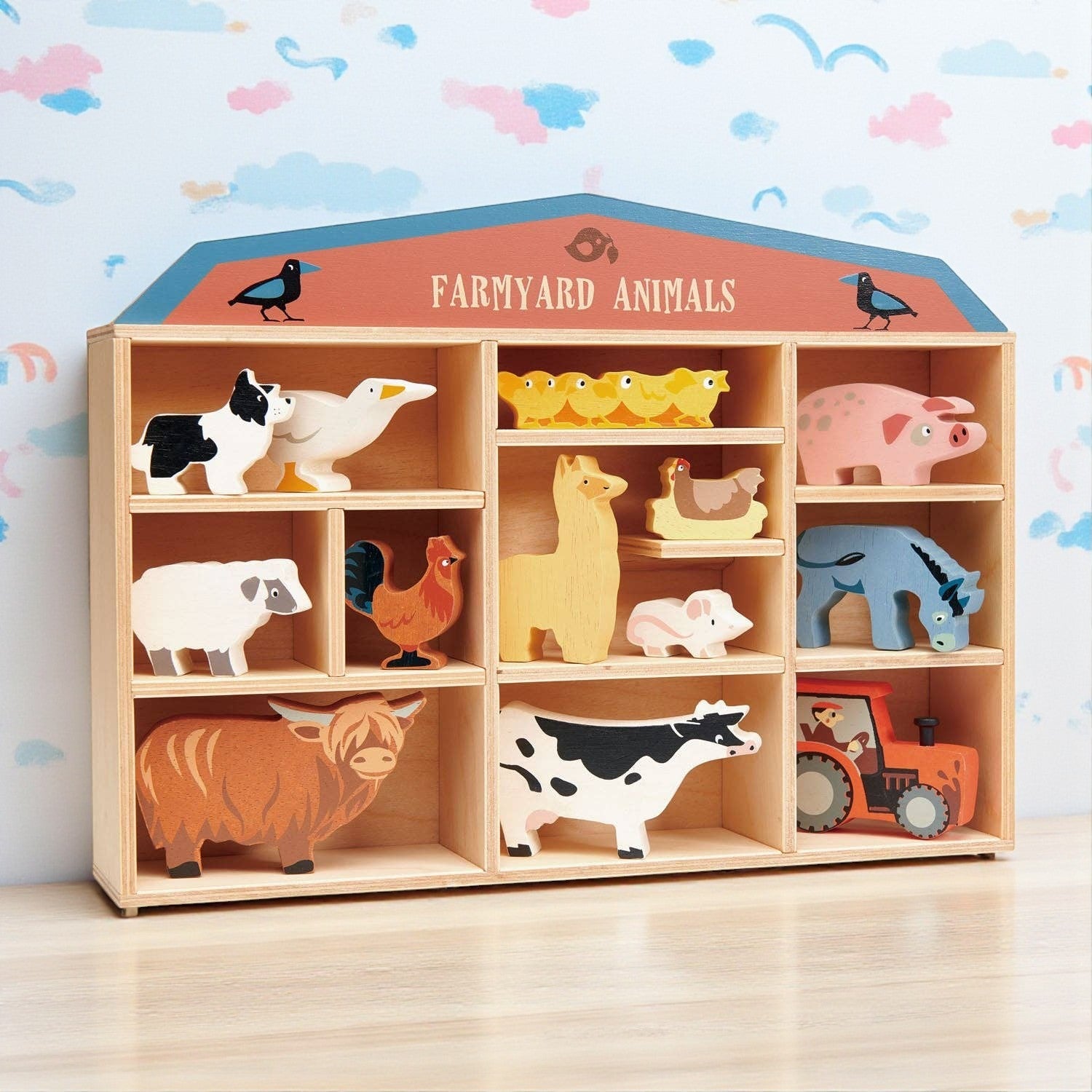 Wooden toy shelf with farmyard animal toys against a colorful wall.