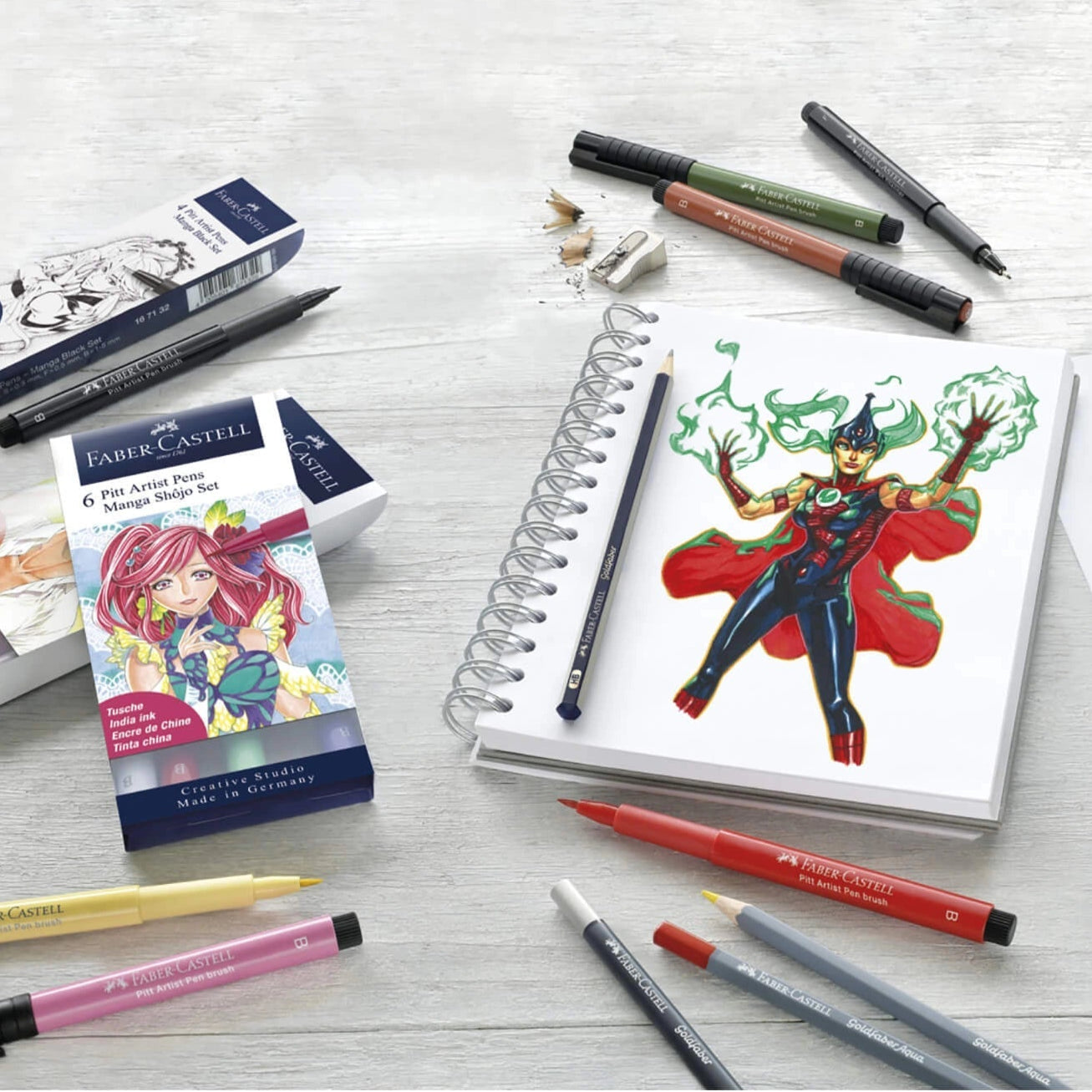 Coloring books and markers on a white surface