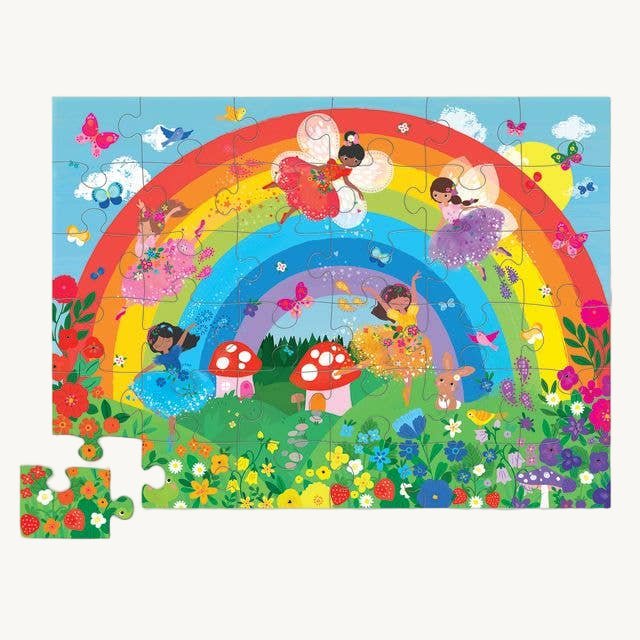 Children's puzzle with a colorful rainbow and fairy design on a blue background