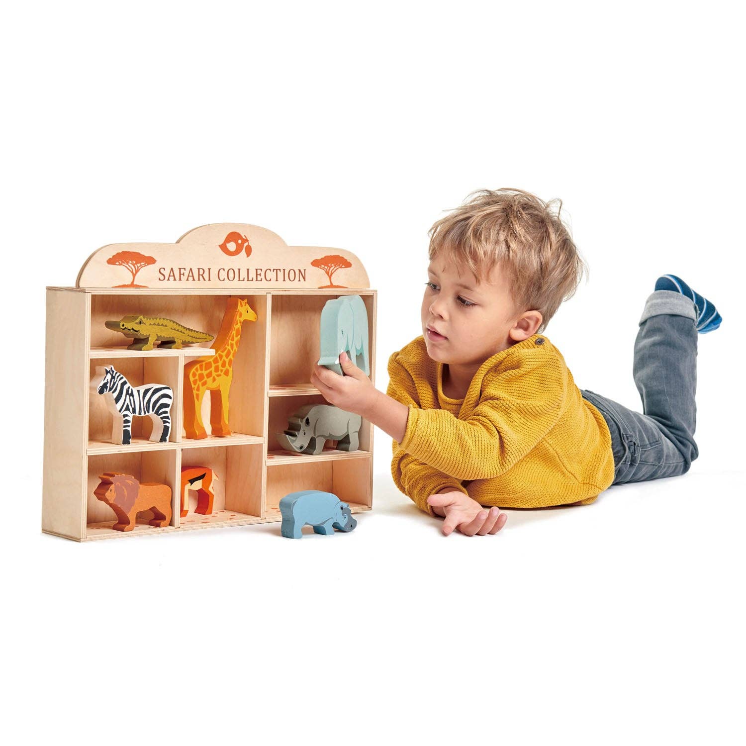 Child playing with a wooden toy shelf labeled 'Safari Collection' on a white background