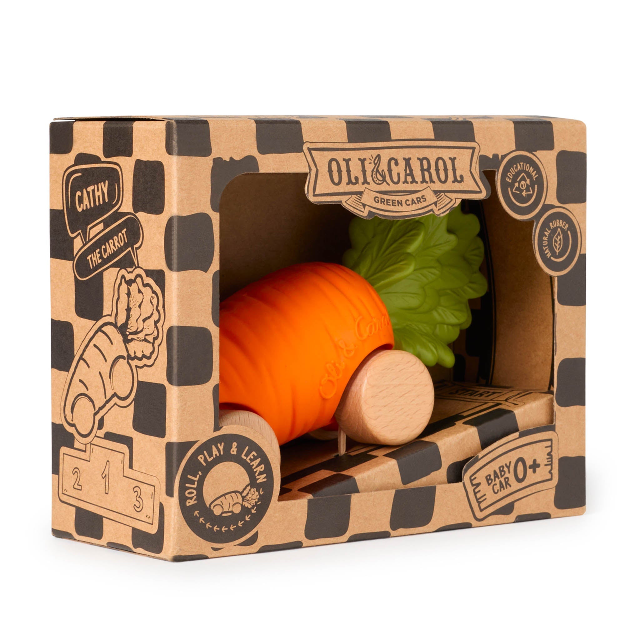 Toy carrot and baby car in a cardboard box with 'Oli & Carol' branding.
