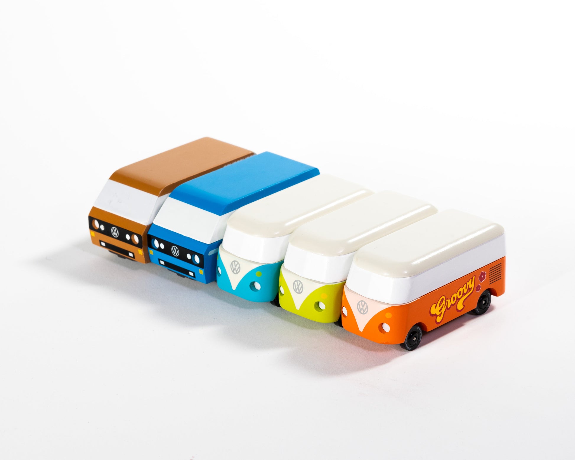 Colorful toy buses arranged in a row on a white background