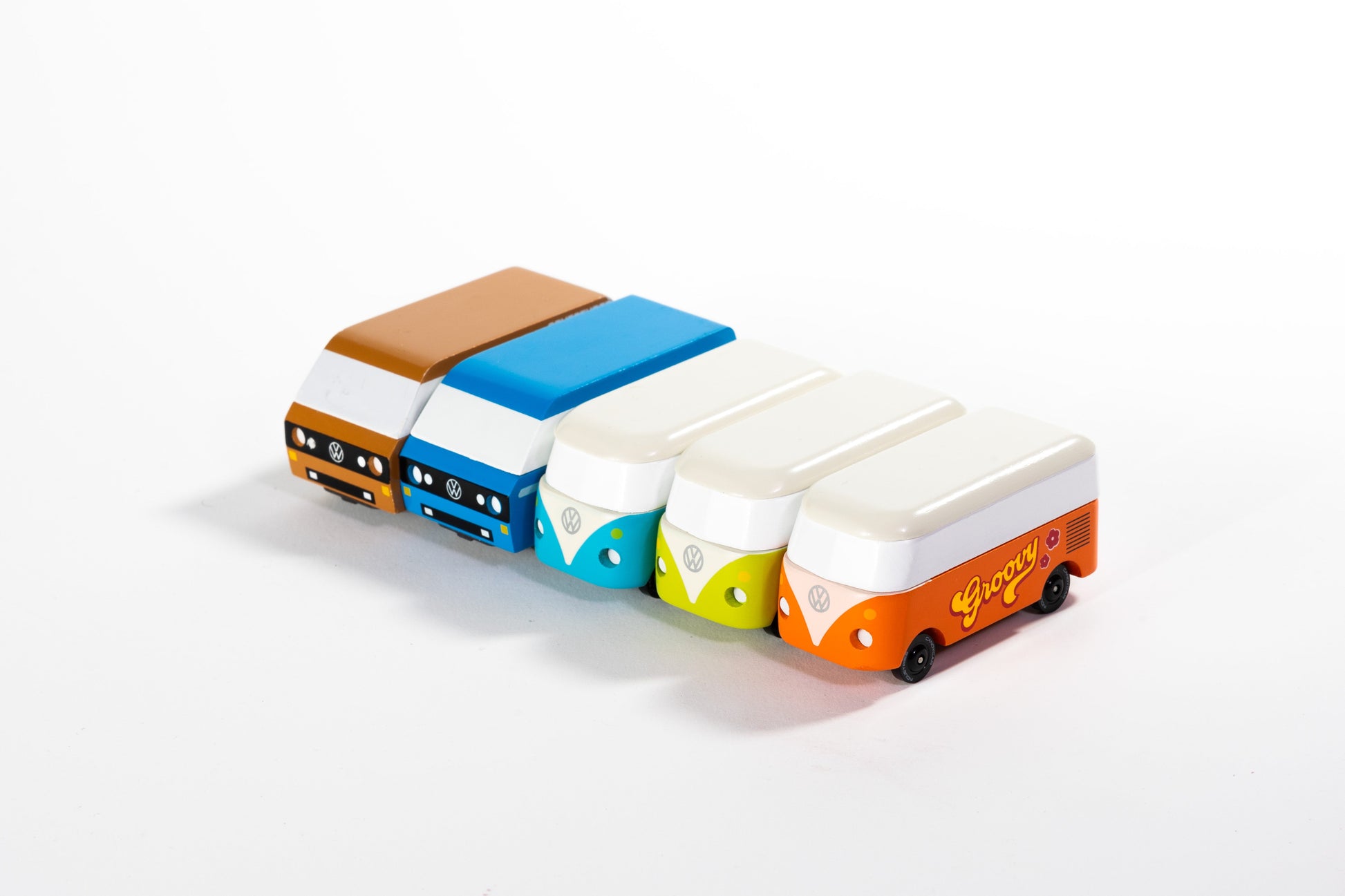 Colorful toy buses arranged in a row on a white background