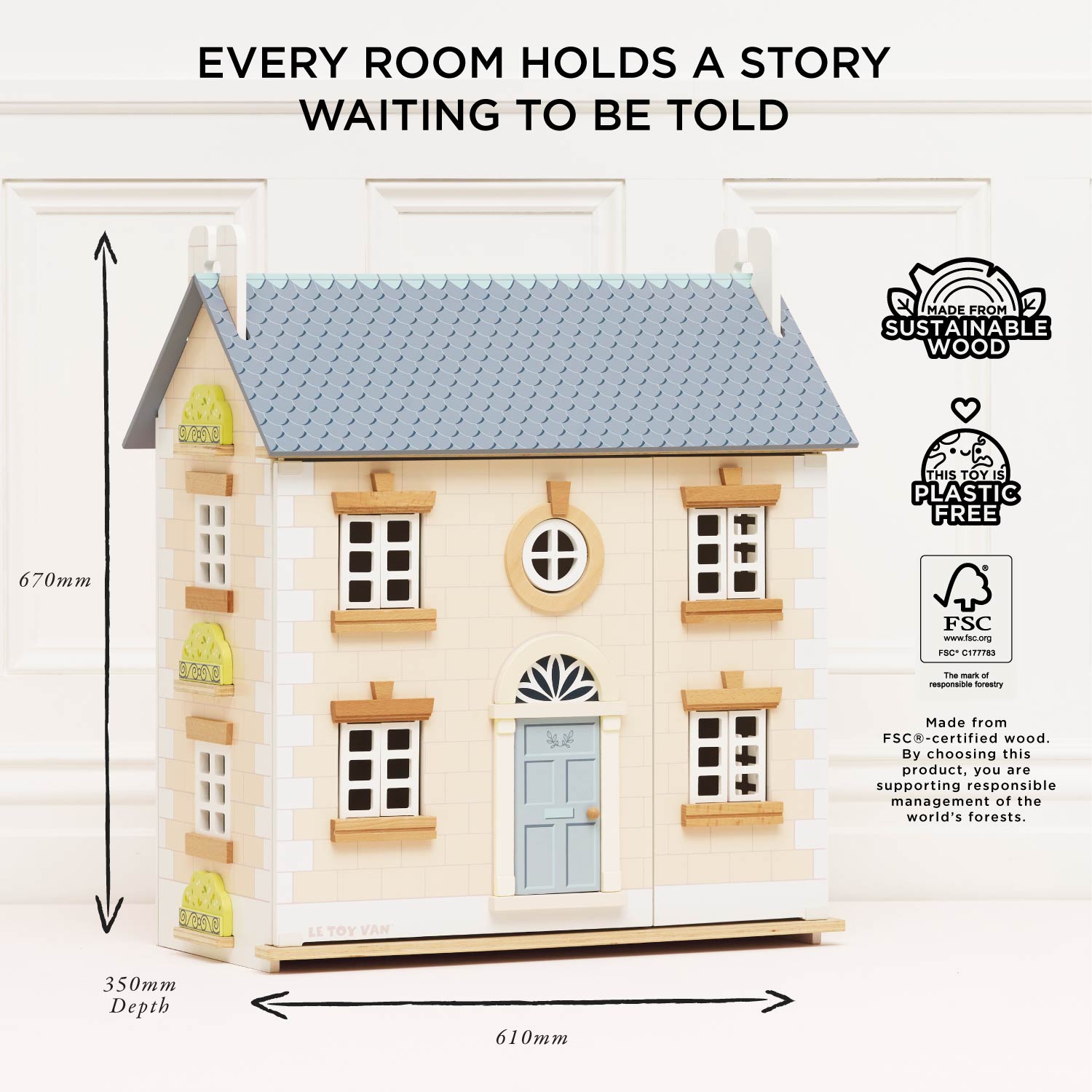 Wooden dollhouse with dimensions and sustainability certifications on a white background