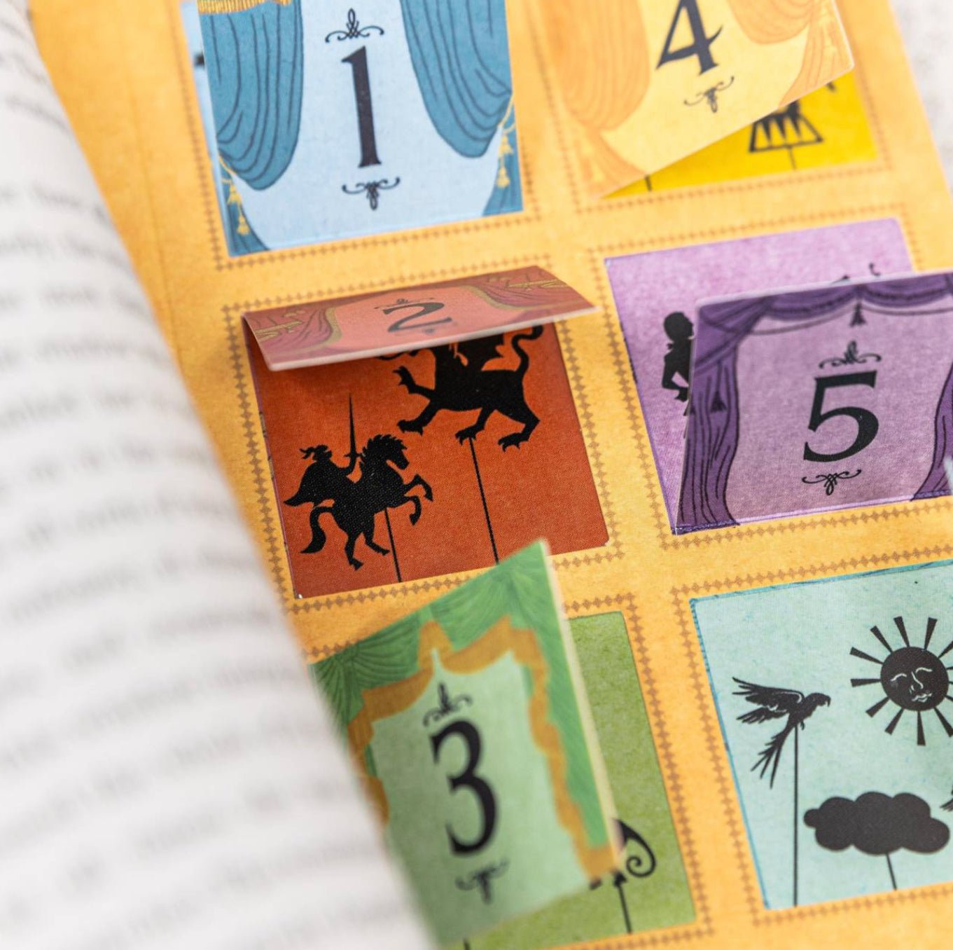 Colorful tarot card set with numbers and symbols on a white fabric background
