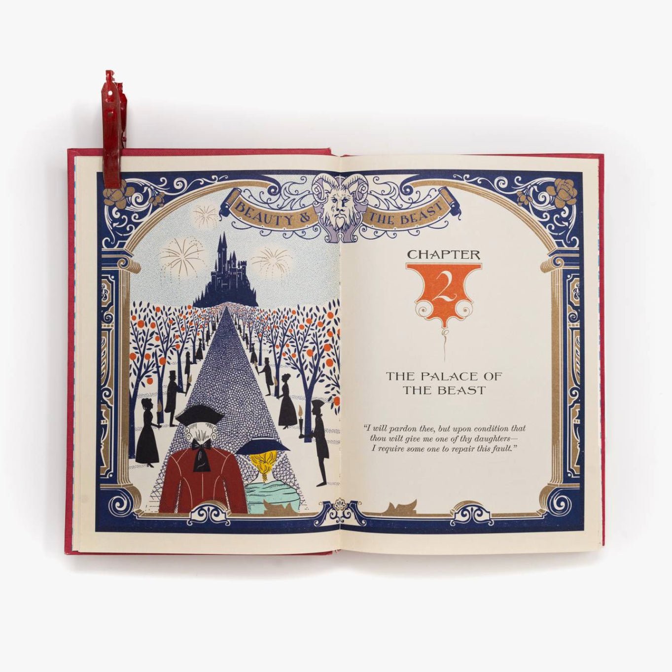Open book with decorative cover featuring illustrations and text, resembling a fairy tale scene.