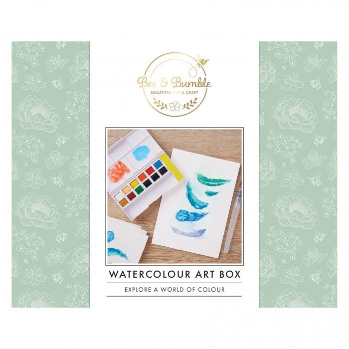 Watercolour art box with watercolor paints and paper on a green background, featuring the brand 'Bee & Bumble'.