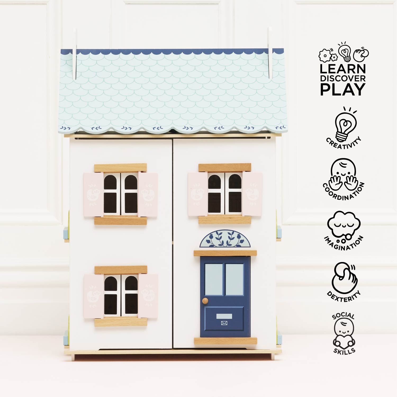 Children's toy house with blue door and windows on a white background, featuring the brand 'Learn Discover Play'.