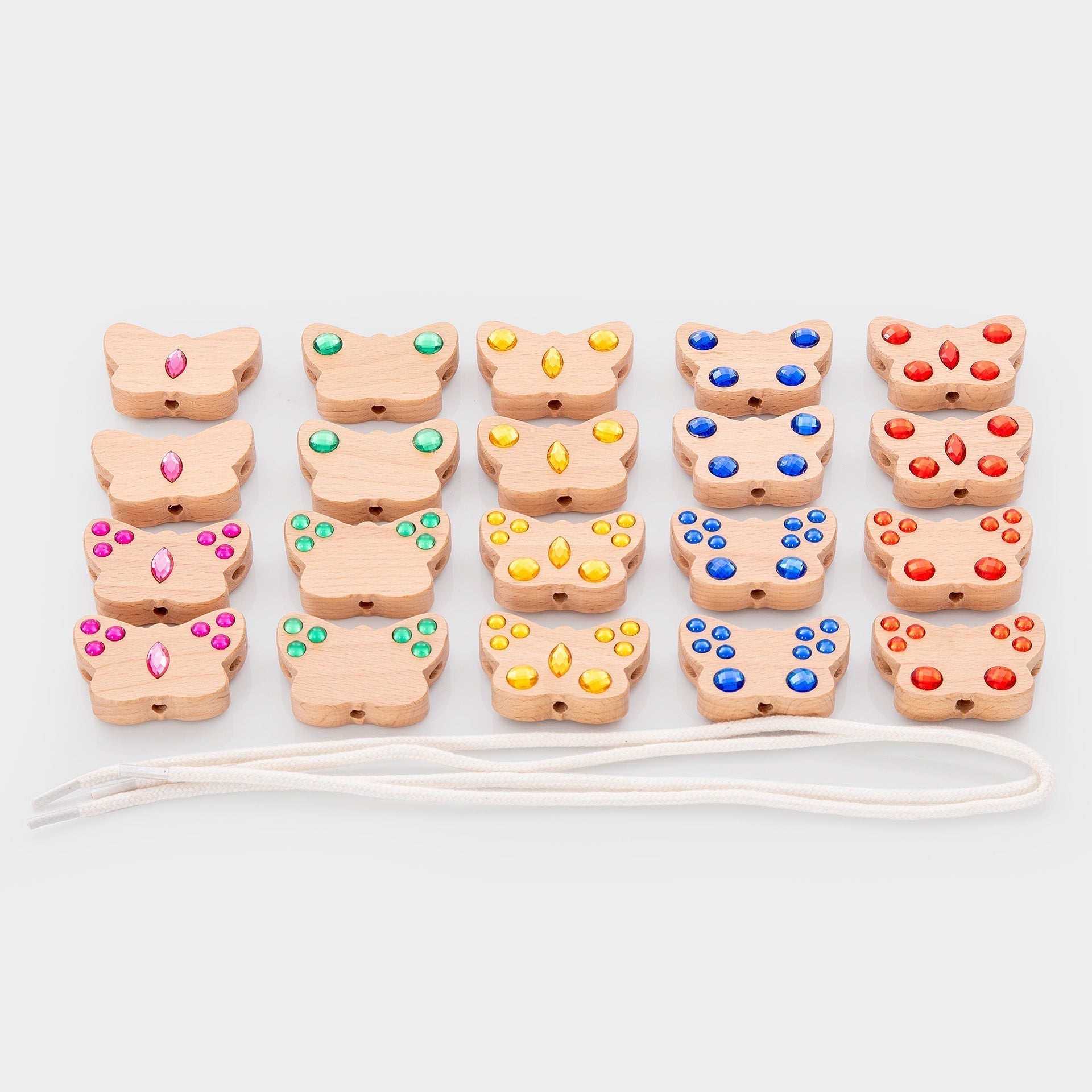 Set of wooden butterfly toys with colored beads on a white background