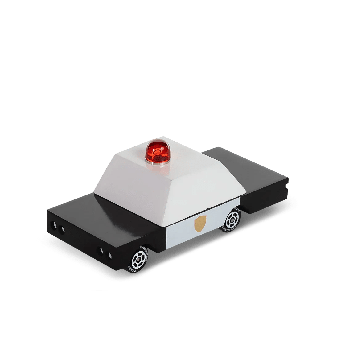 Toy police car with a red light on a white background