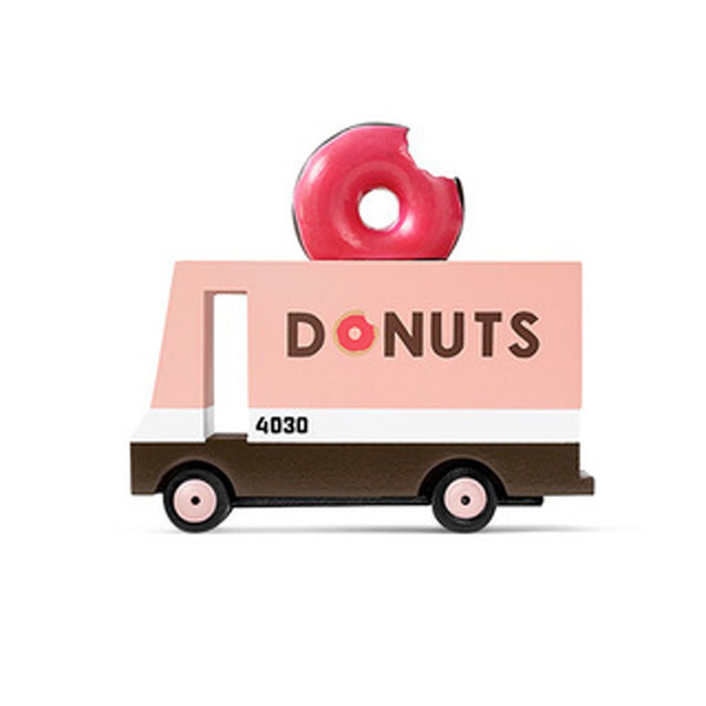 Toy donut truck with a pink donut on top against a white background