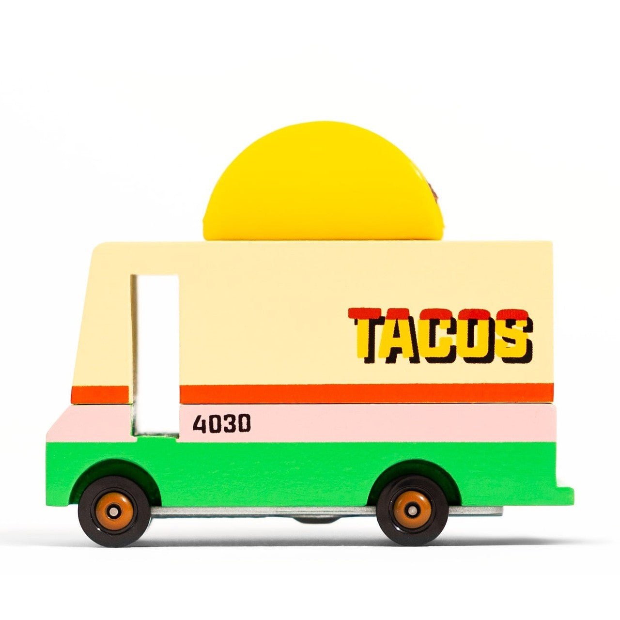 Toy taco truck with a yellow roof and green base on a white background