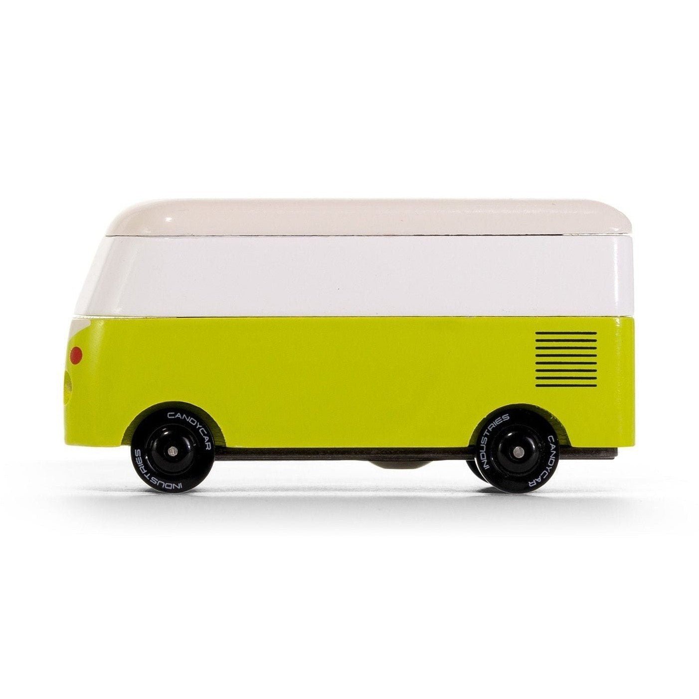 Small model of a yellow van with a white top on a white background