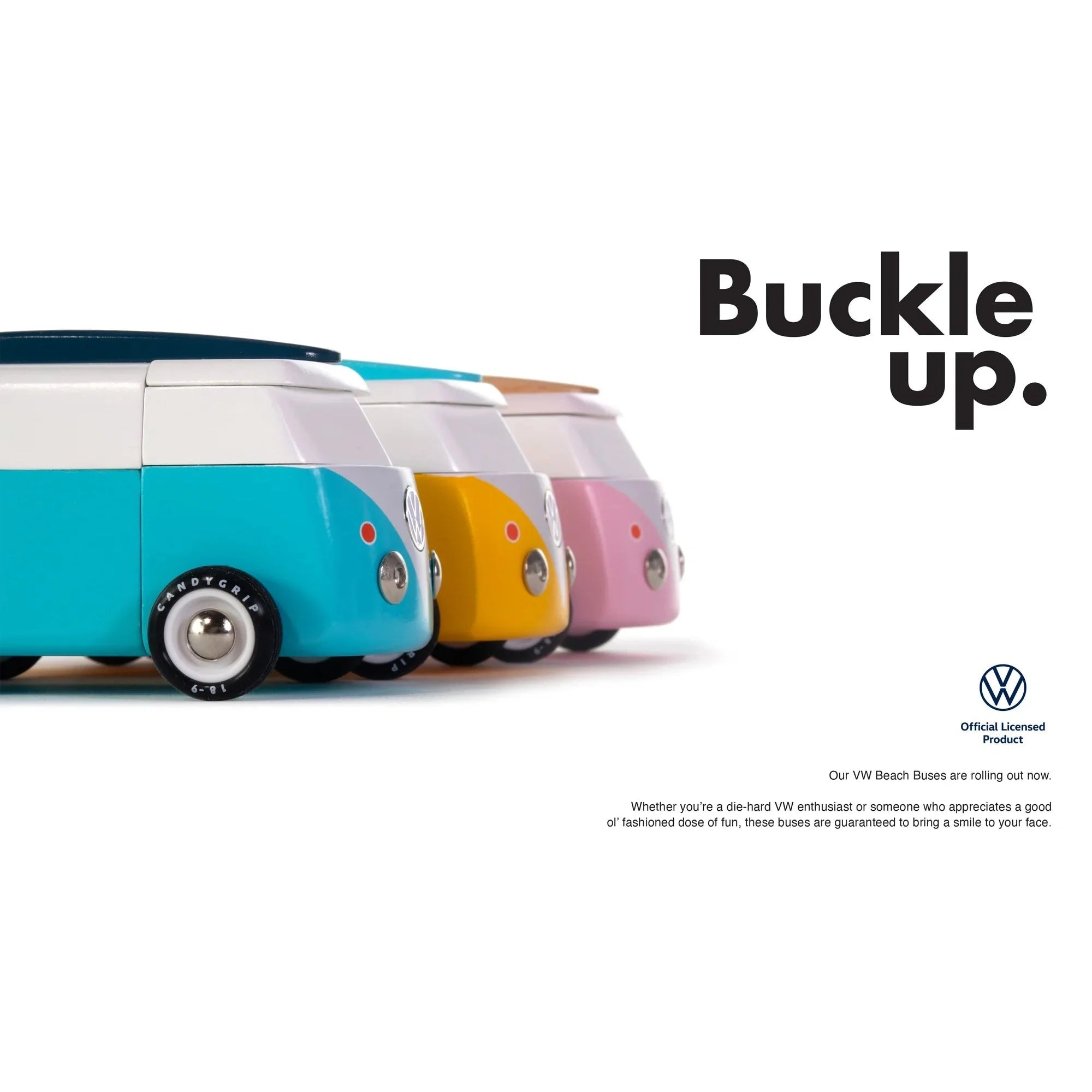 Four colorful VW beach buses in a row with 'Buckle up.' text and Volkswagen logo.
