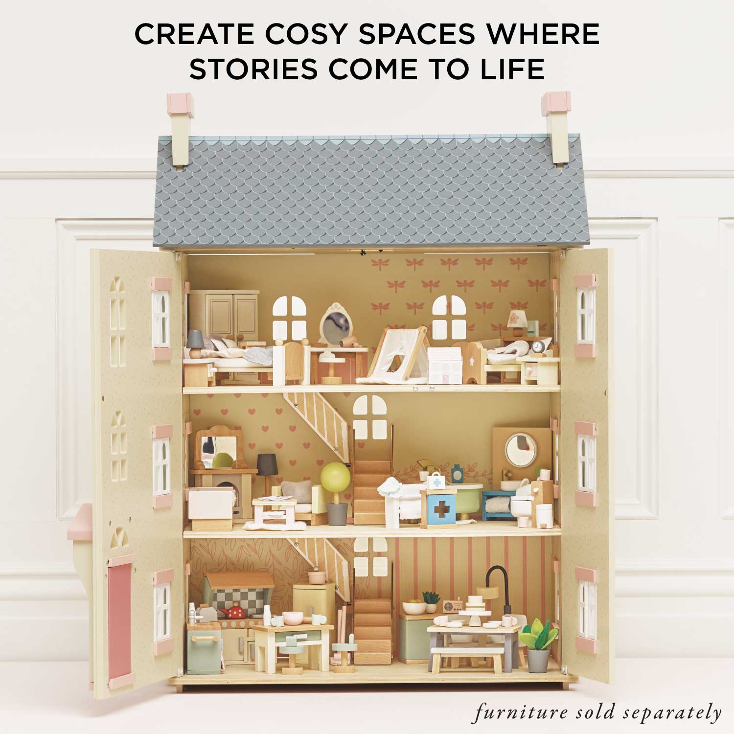 Wooden dollhouse with detailed interior and text 'Create Cosy Spaces Where Stories Come to Life'.