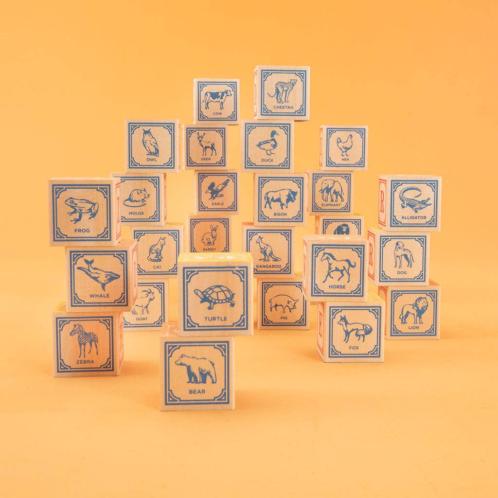 Set of animal-themed blocks on a yellow background