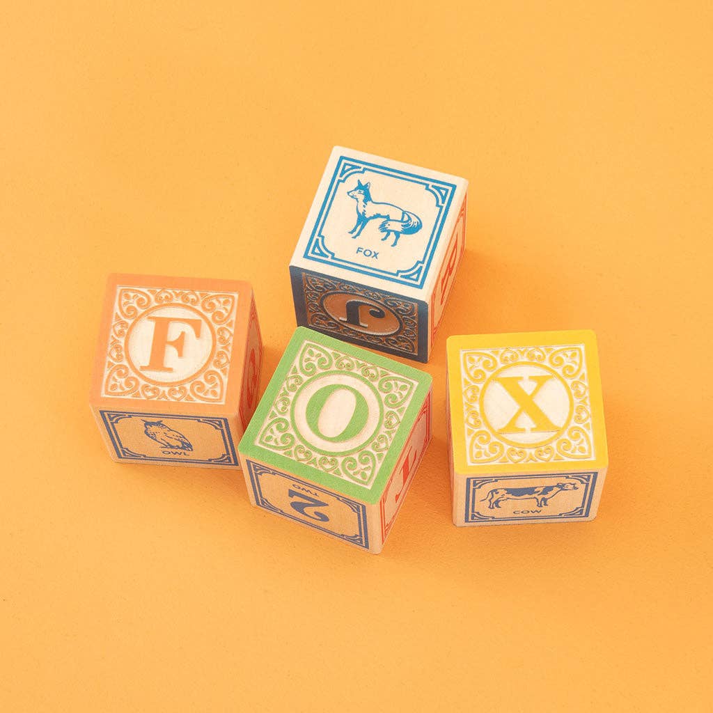 Set of wooden blocks with letters on an orange background