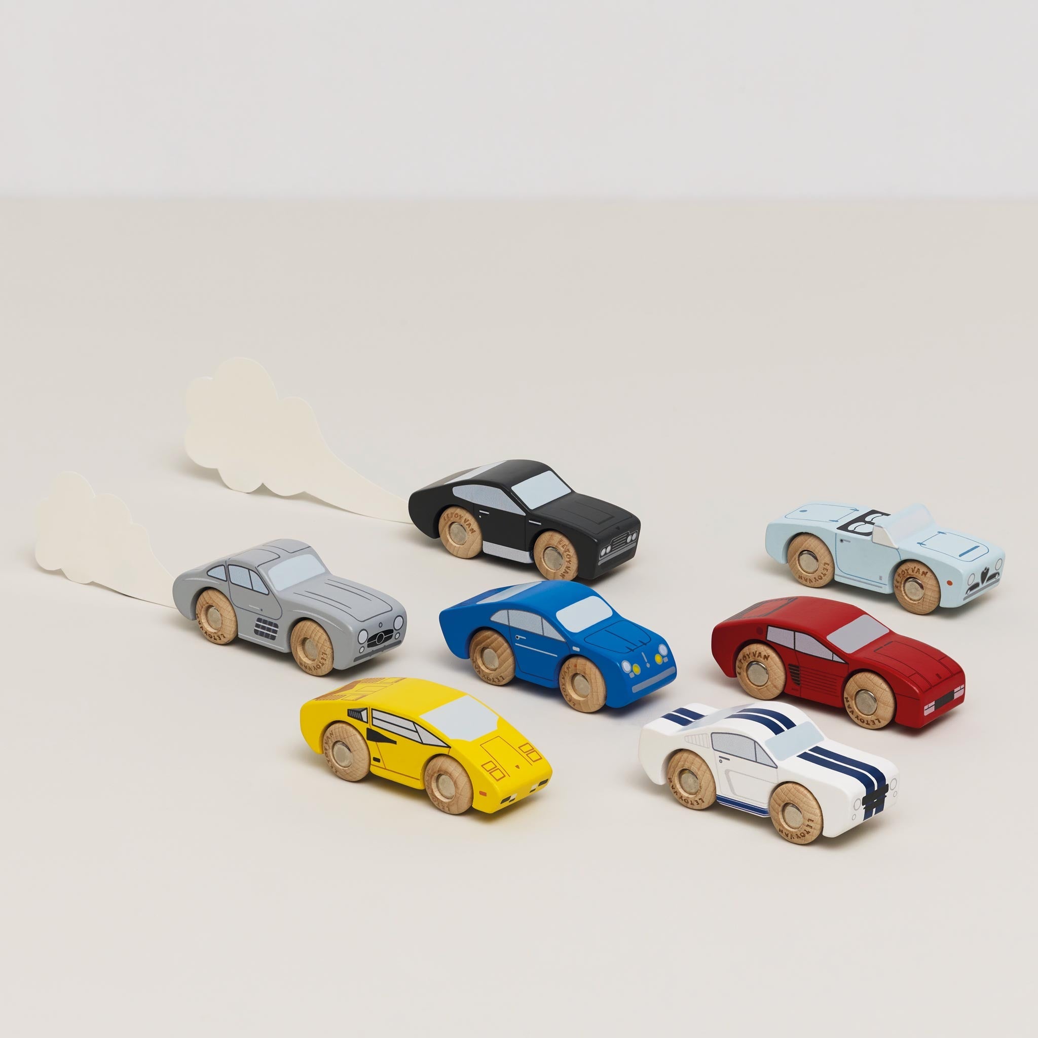 Set of colorful toy cars on a light background