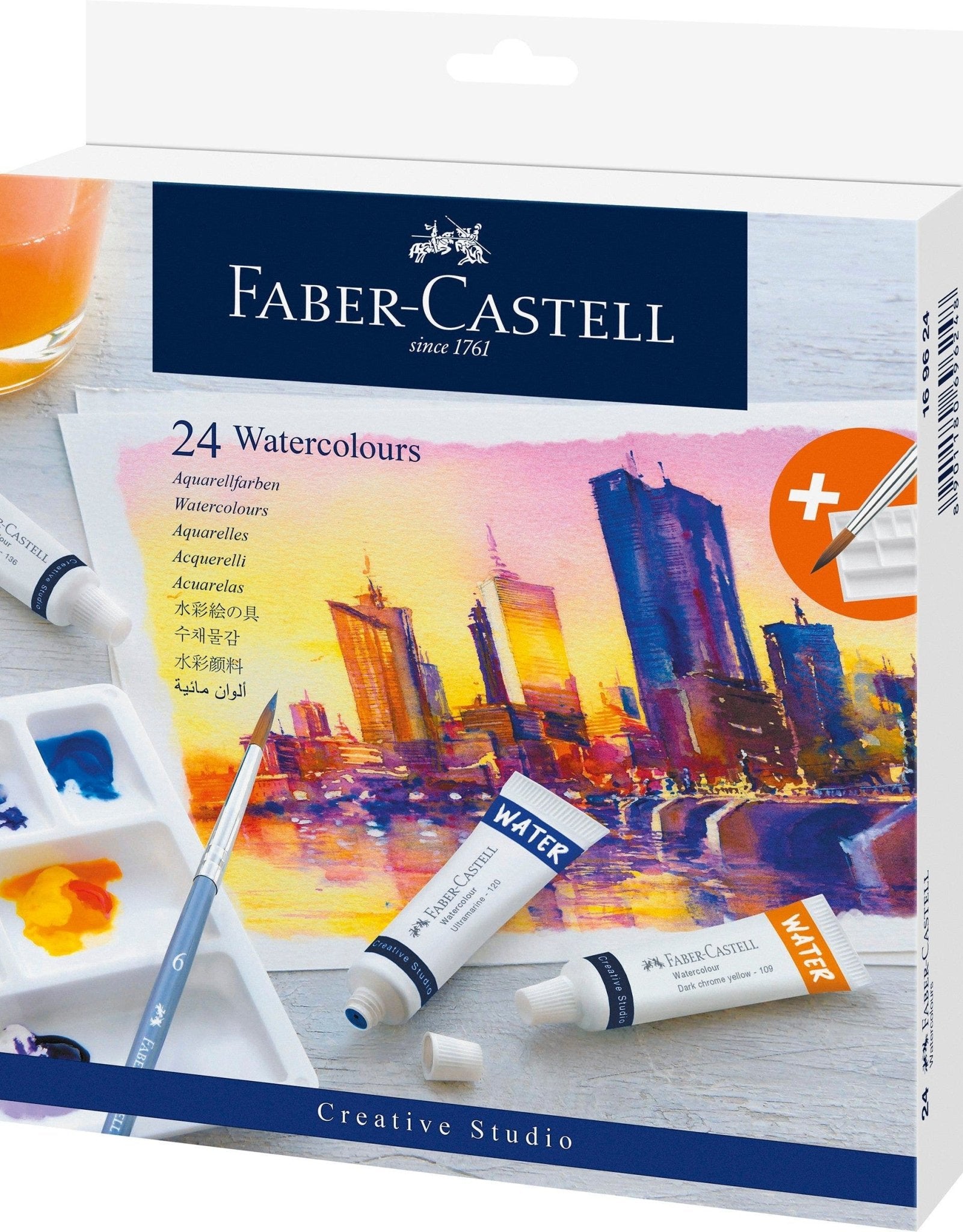 Faber-Castell watercolor set packaging with watercolor tubes and a brush on a cityscape background.