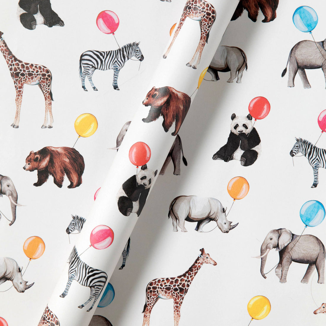Wrinkled sheet of paper with animal illustrations and colorful balloons on a white background