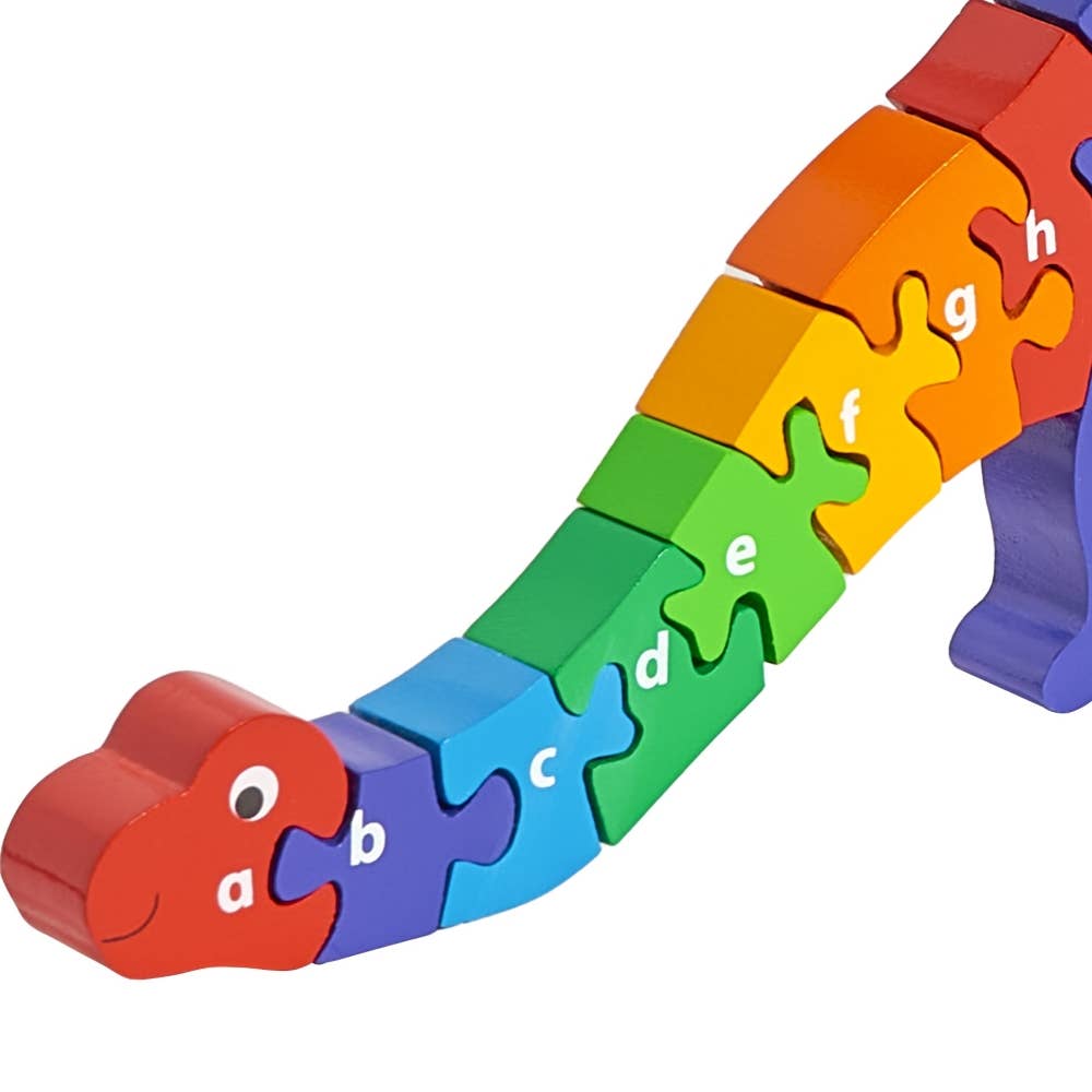 Colorful dinosaur-shaped puzzle with letters on a white background