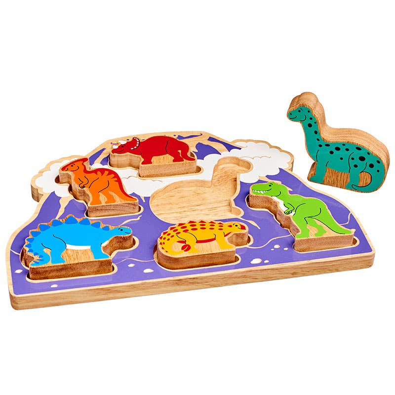 Wooden puzzle with dinosaur shapes on a white background
