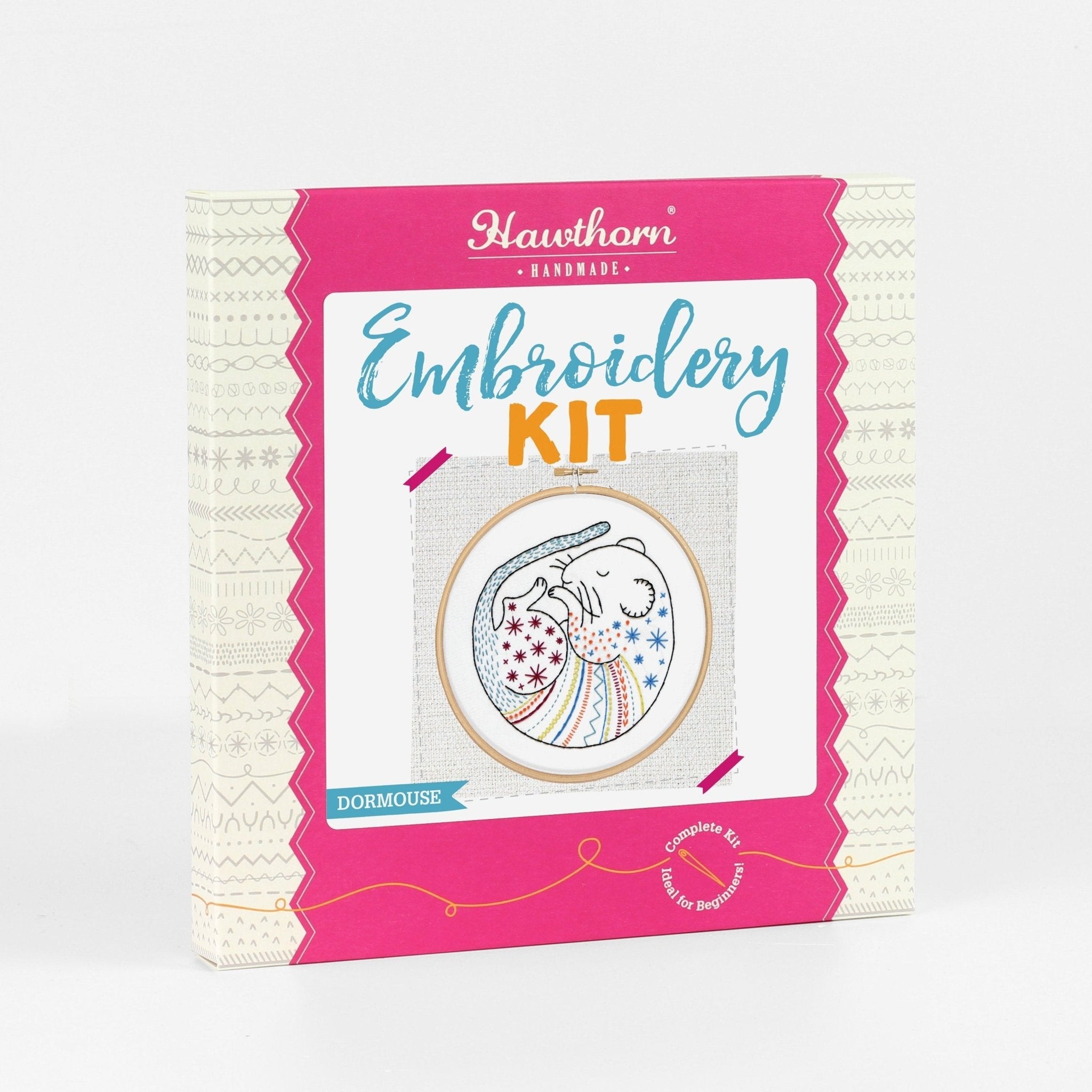 Embroidery kit packaging with pink border and white background