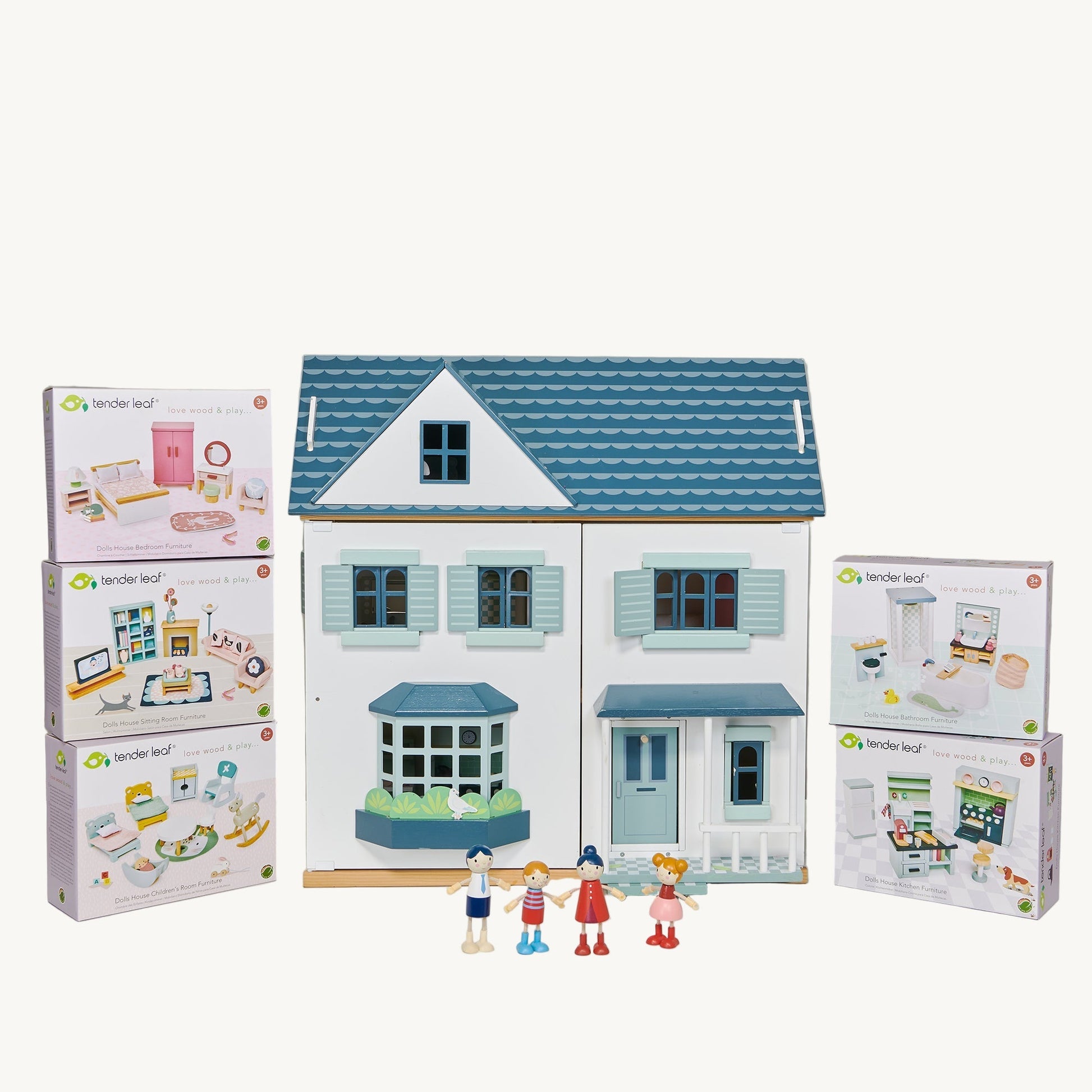 Toy house with miniature accessories and packaging on a gray background