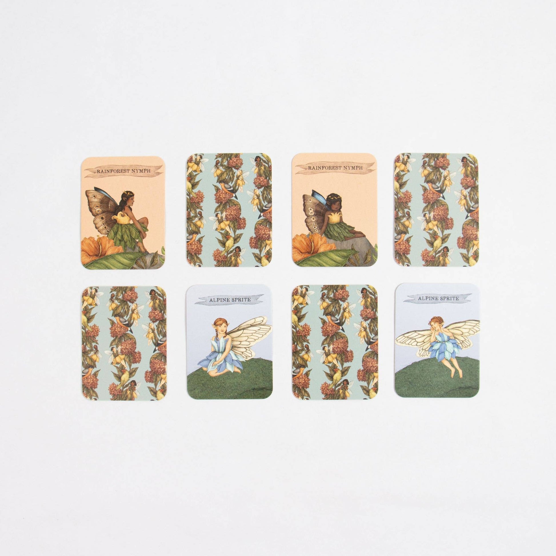Set of six tarot cards featuring fairies and floral designs on a light gray background