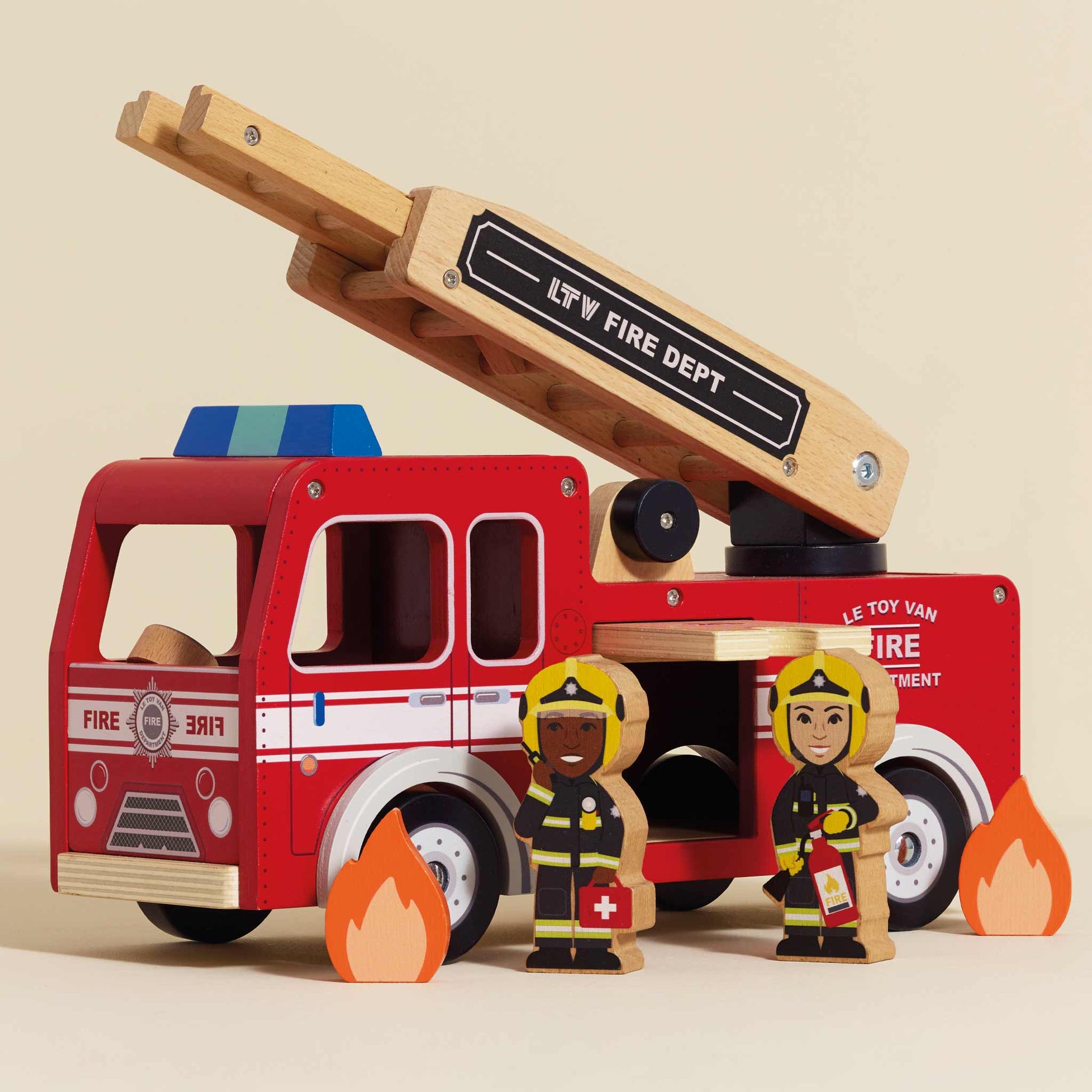 Wooden toy fire truck with a ladder, two fireman figures, and flames on a beige background.
