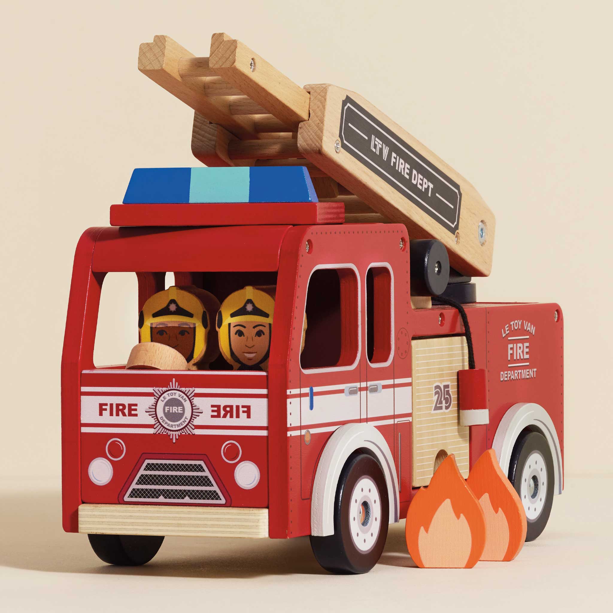 Wooden toy fire truck with details and figures on a beige background