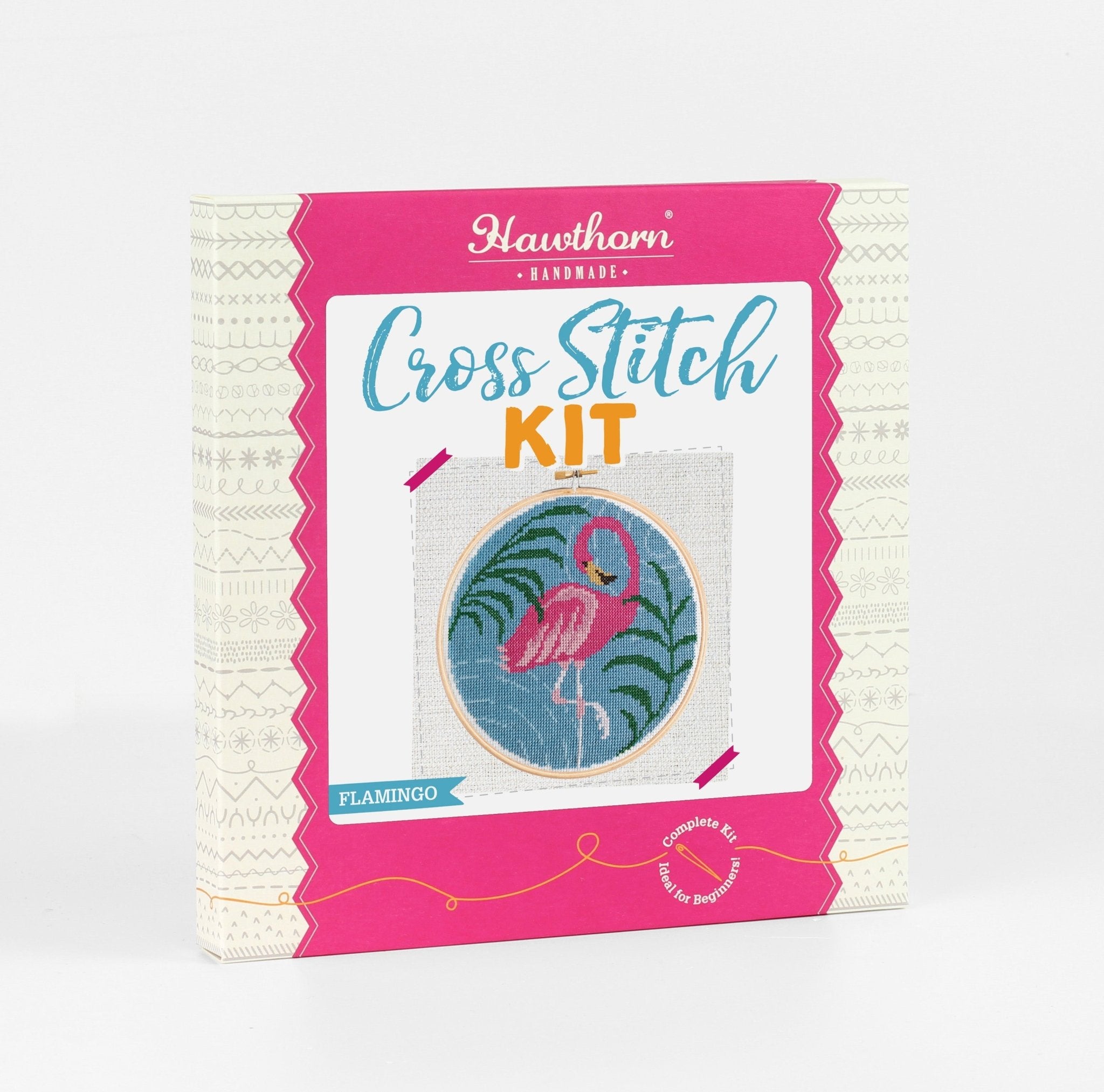 Cross stitch kit packaging with flamingo design on a white background