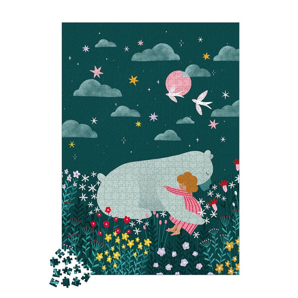 Jigsaw puzzle packaging with a design of a girl and bear under a starry sky.