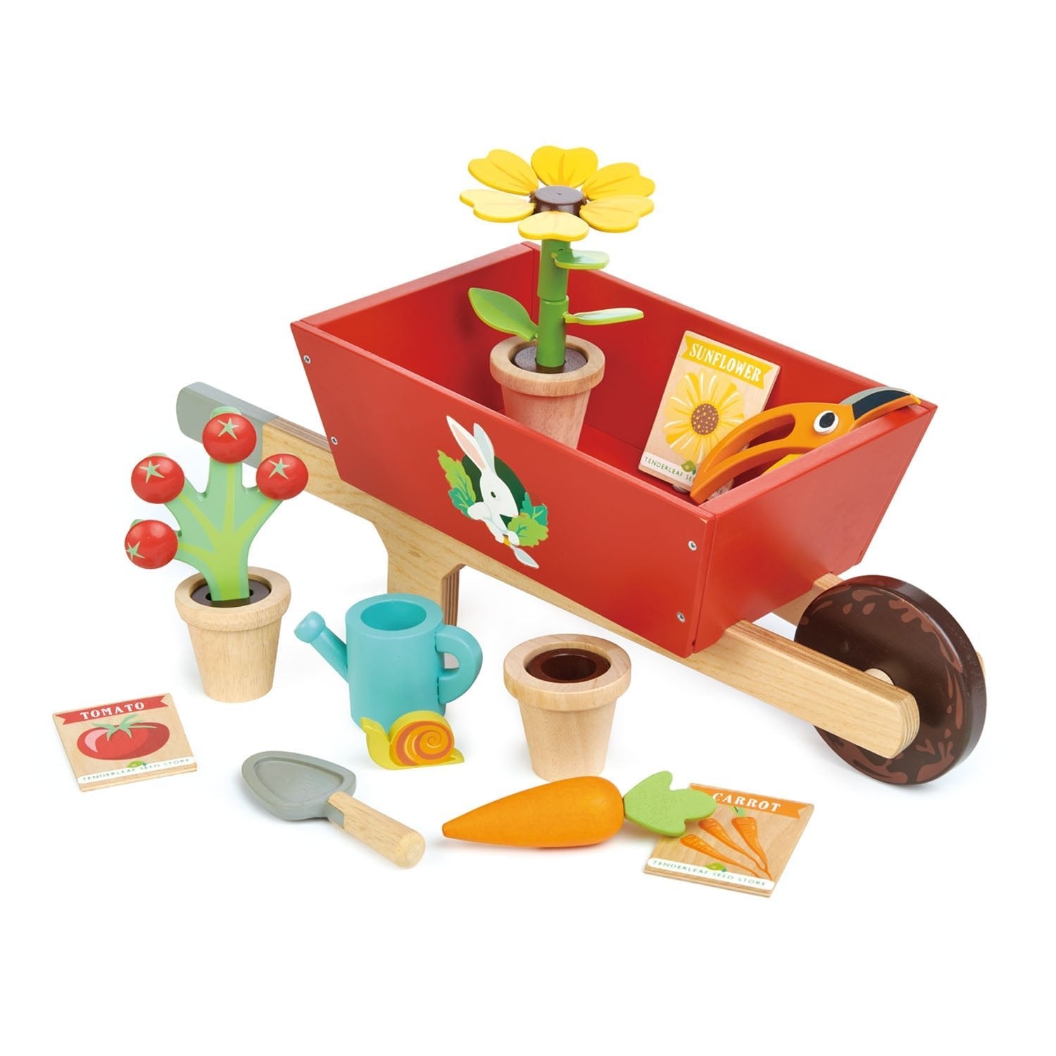 Toy gardening set with a red wheelbarrow, plants, tools, and seed packets on a white background