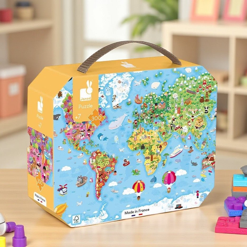 World map puzzle box on a wooden surface with toys around