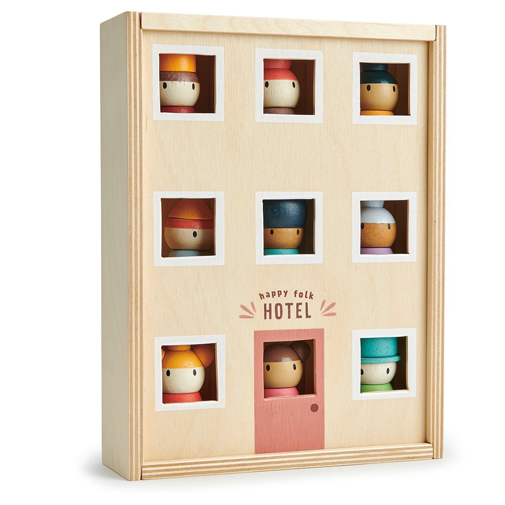 Wooden toy hotel with small rooms and a door, featuring colorful toy figures inside.