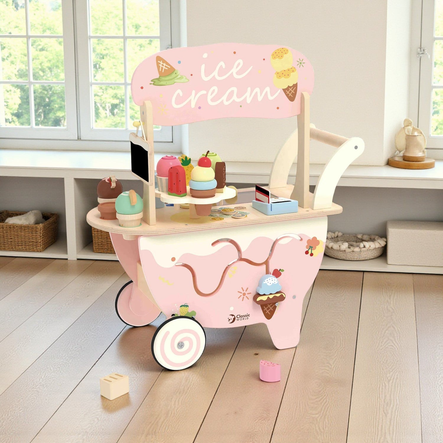 Pink toy ice cream cart with wooden shelves and ice cream-themed decorations on a wooden floor.