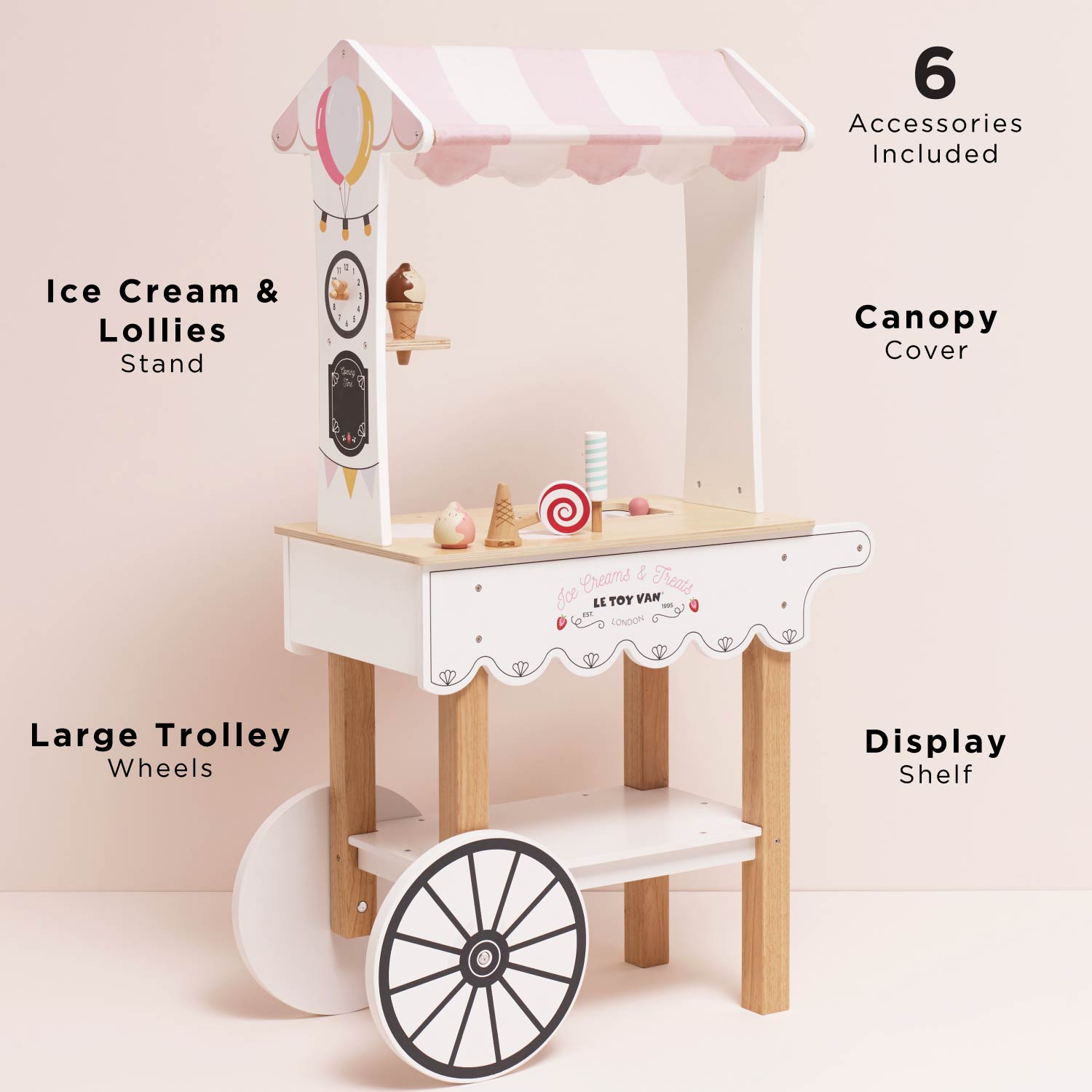 Wooden ice cream stand with canopy, wheels, and display shelf on a light pink background