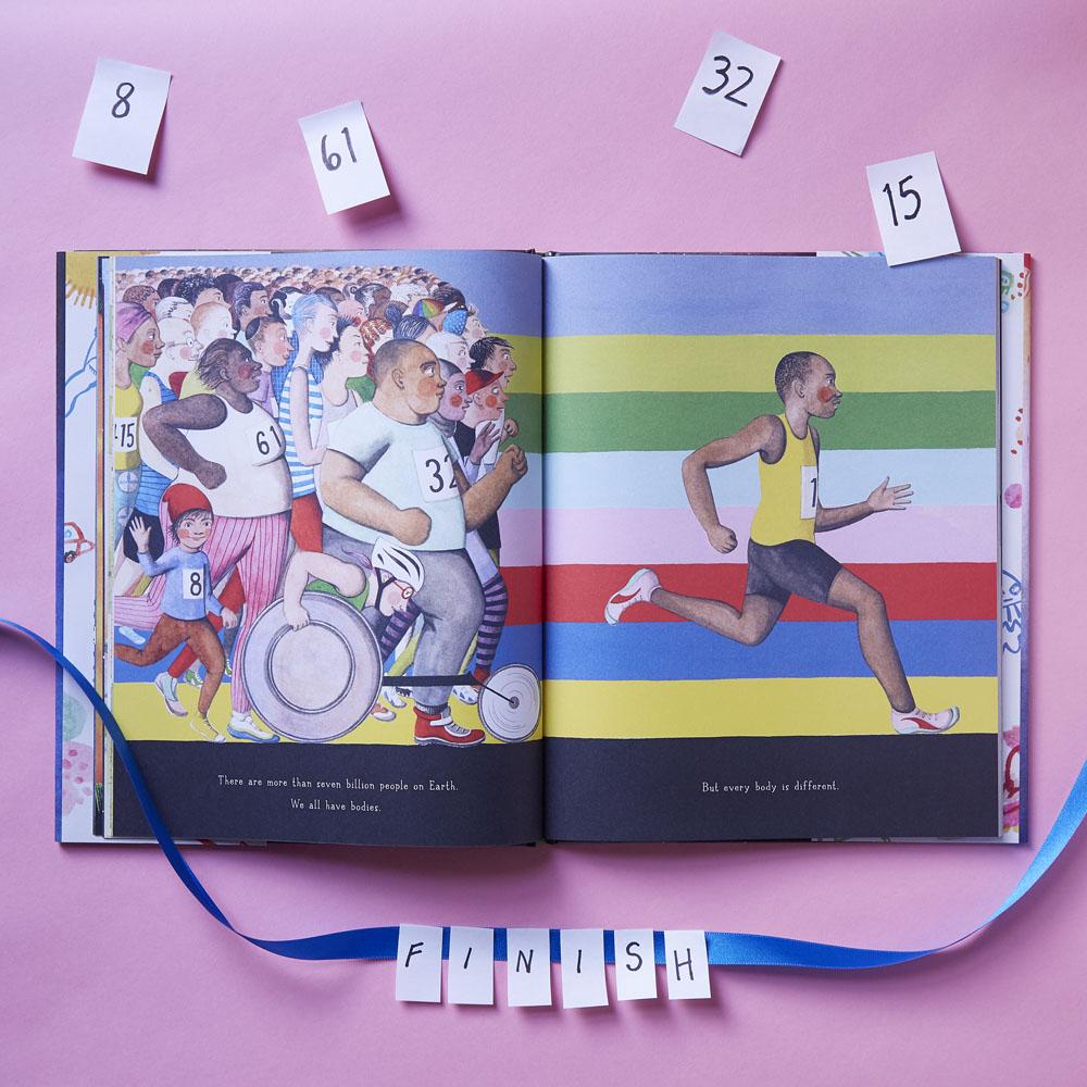 Open book with illustrations of people running and a colorful striped background on a pink background.