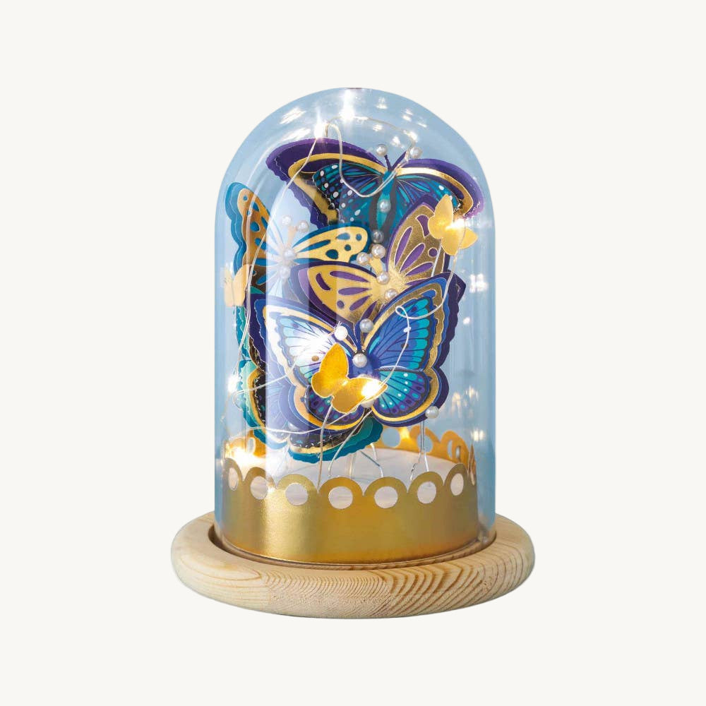 Decorative glass dome with butterflies on a white background