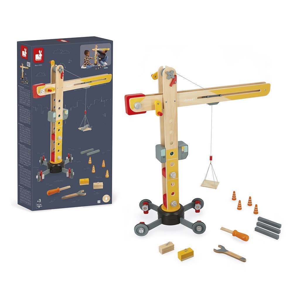 Wooden toy crane set with tools and packaging on a white background