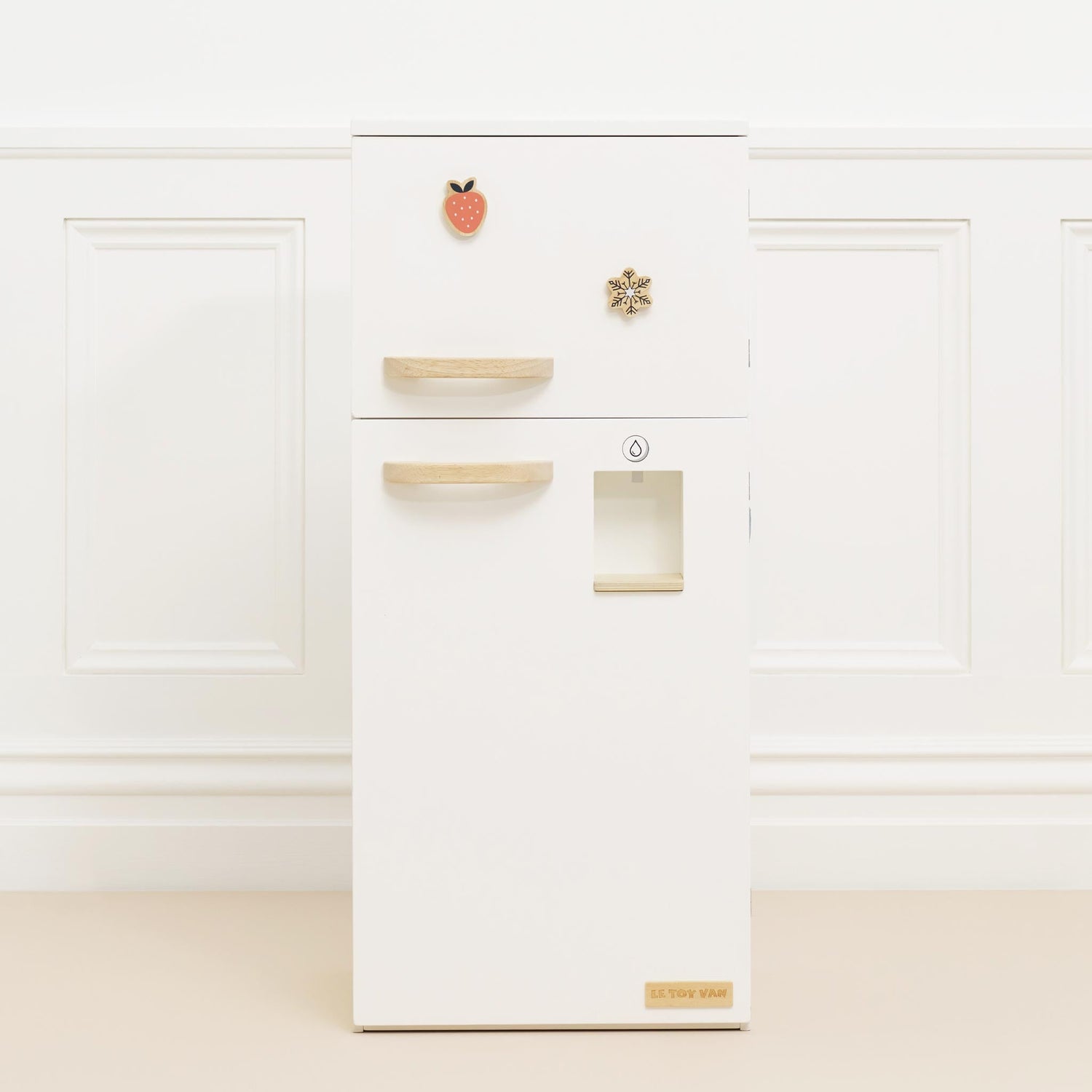 White kitchen cabinet with gold handles on a white background