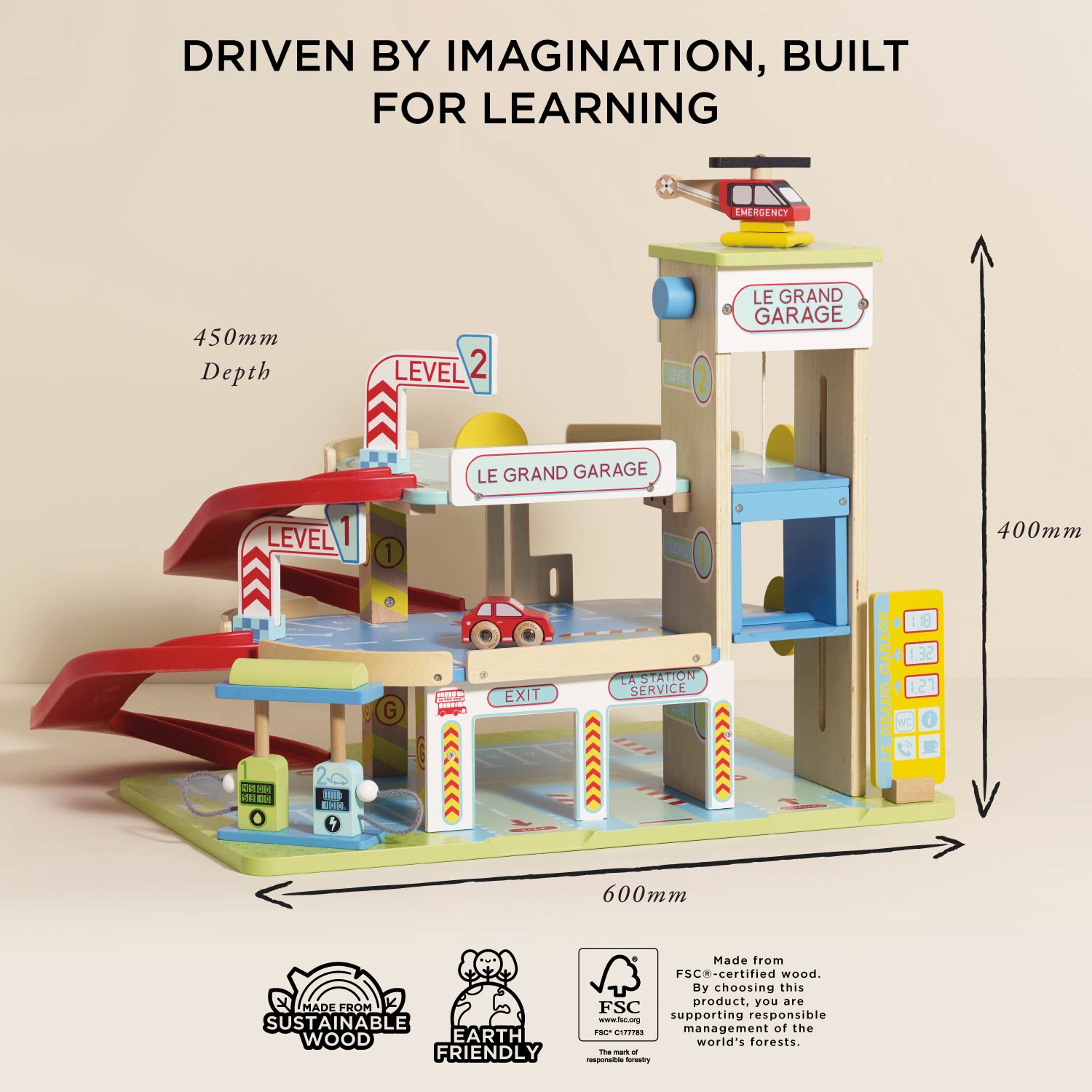 Wooden toy garage with cars and helicopter, labeled 'Le Grand Garage', on a beige background.