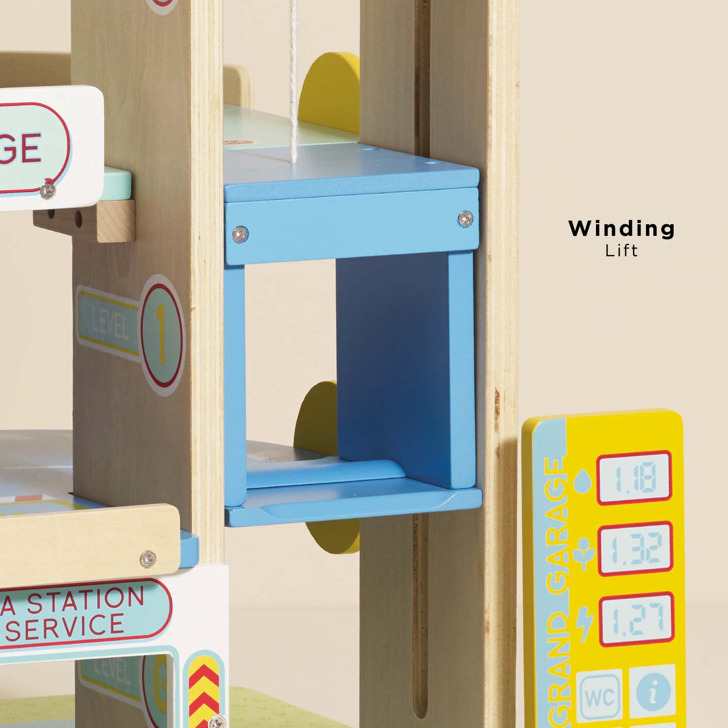 Wooden toy garage with a winding lift mechanism and colorful signs.