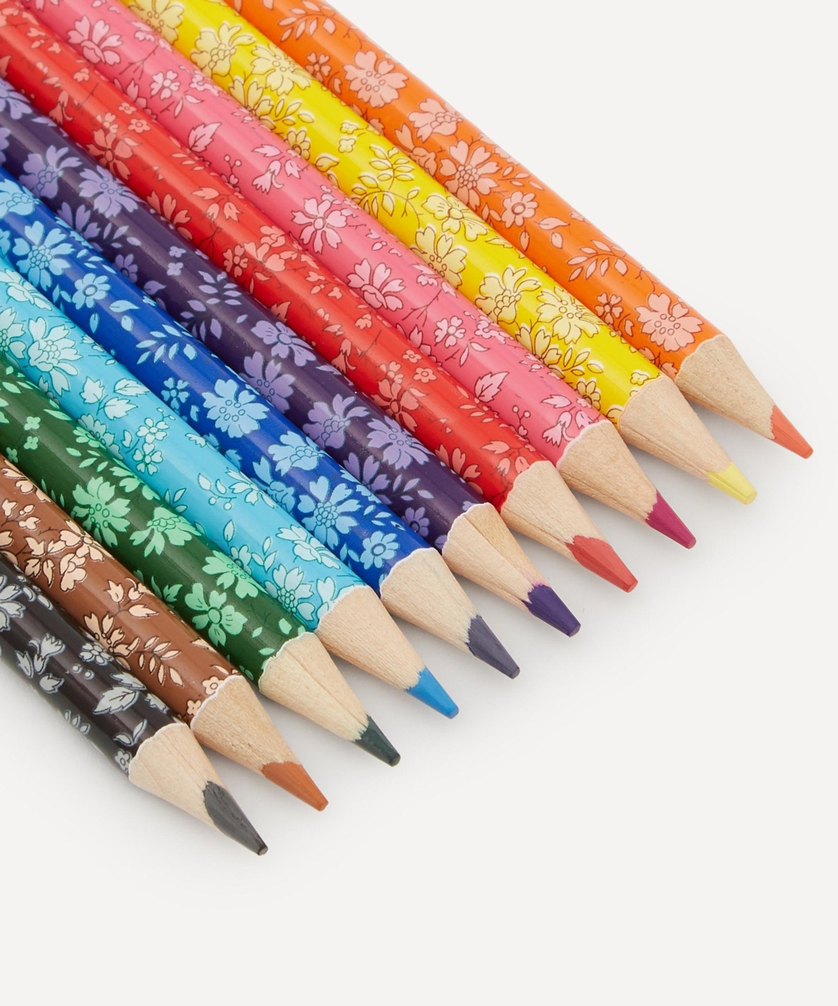 Set of colorful patterned pencils on a white background