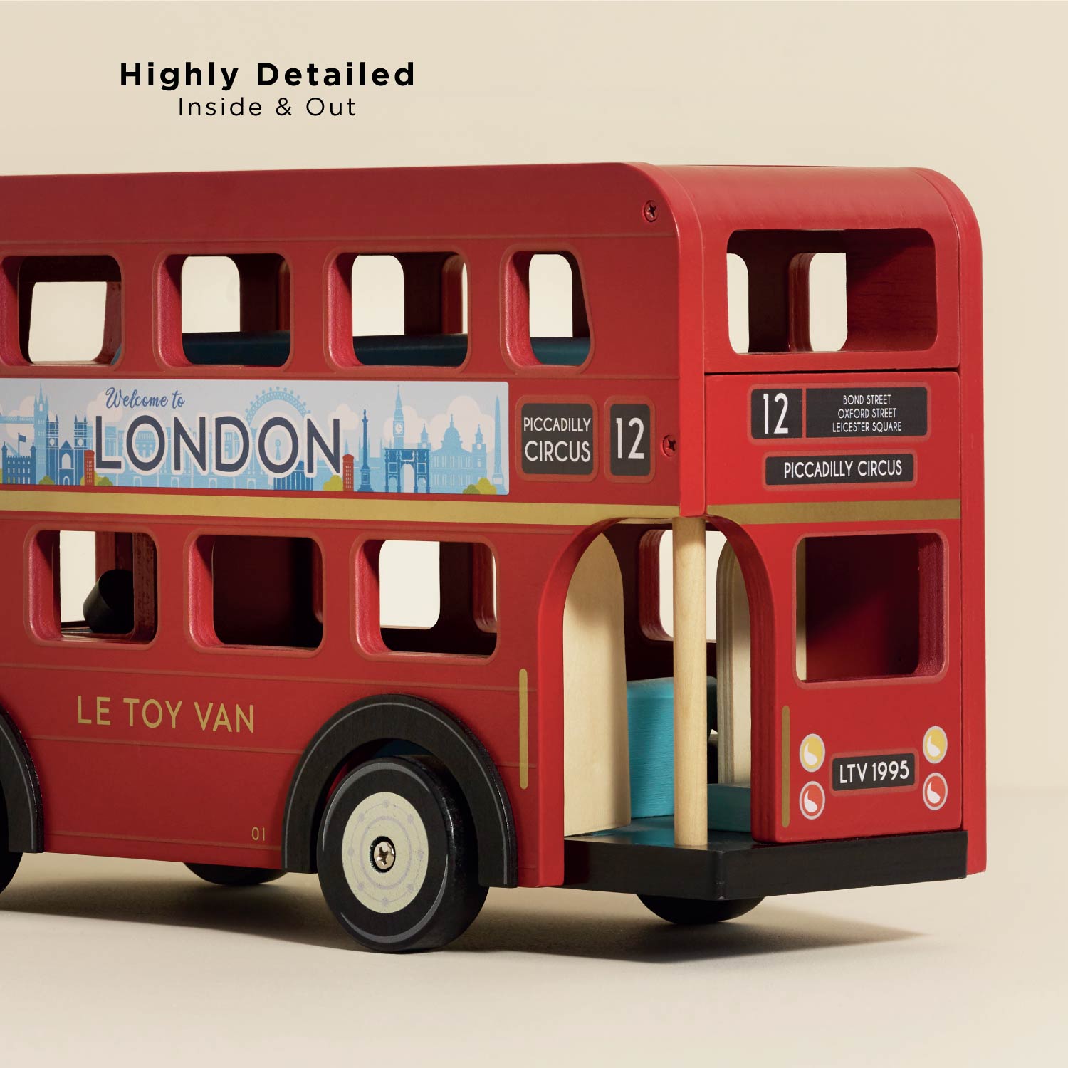 Red toy double-decker bus with detailed design on a beige background