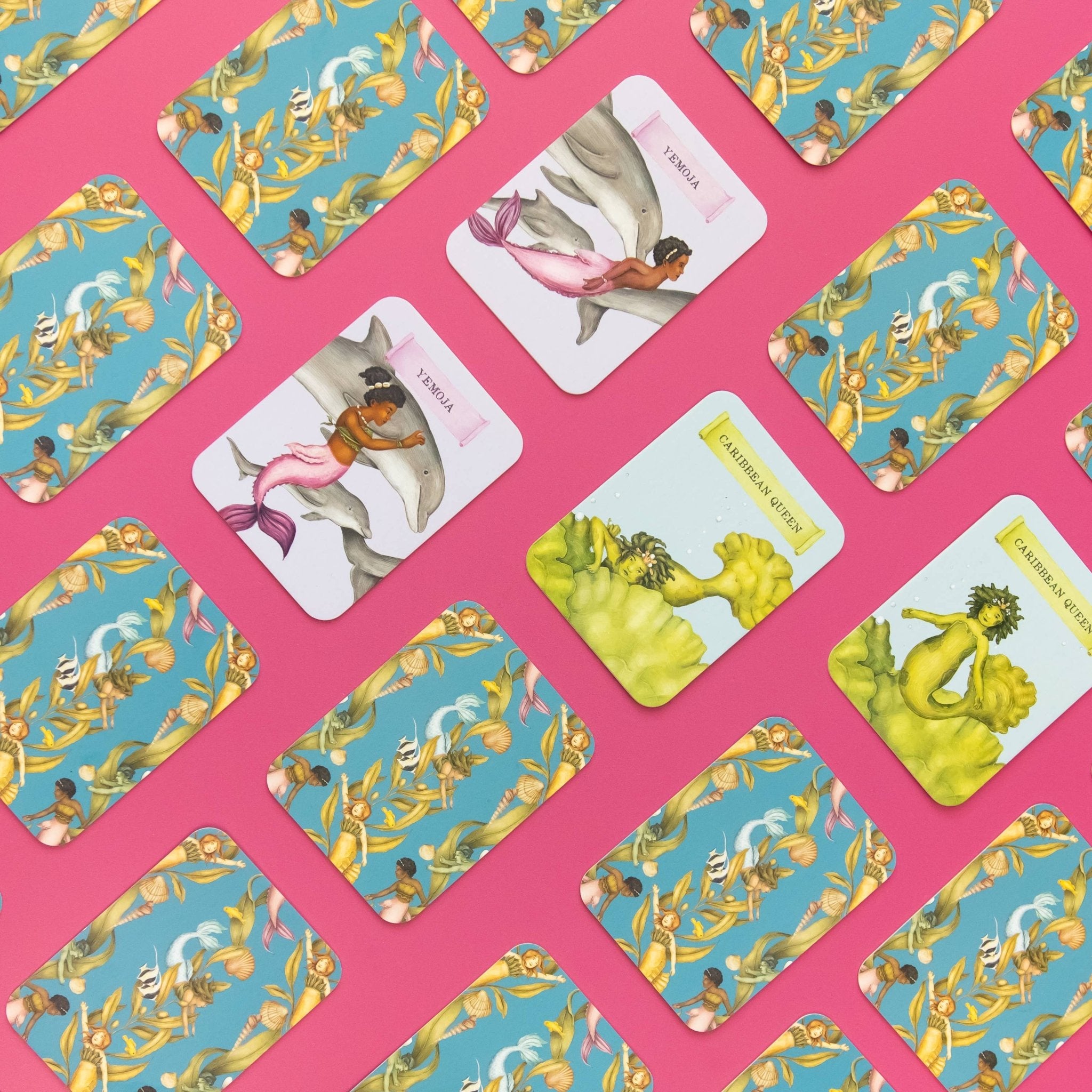 Pattern of tarot cards with mermaid illustrations on a pink background